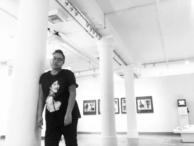 Self-portrait of AC on the eve of their birthday, at the Leslie-Lohman Museum of Gay and Lesbian Art
