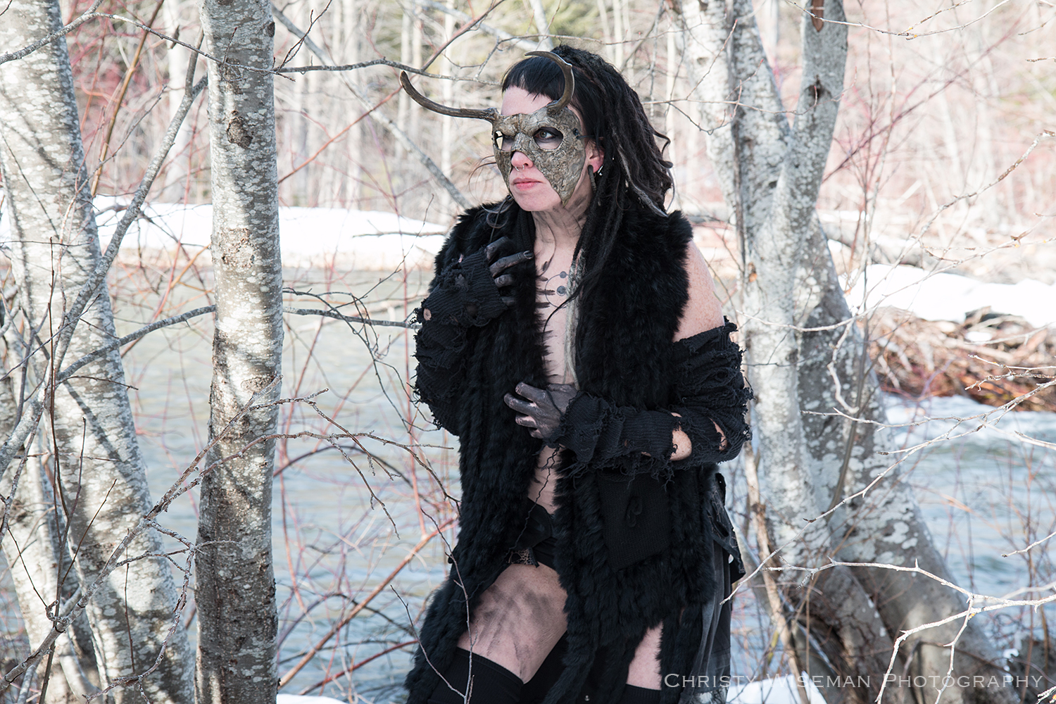 Amy in mask walking by river SQ.jpg