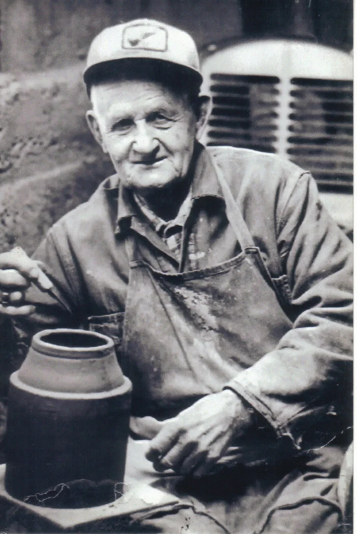 Amos Hatch in his pottery