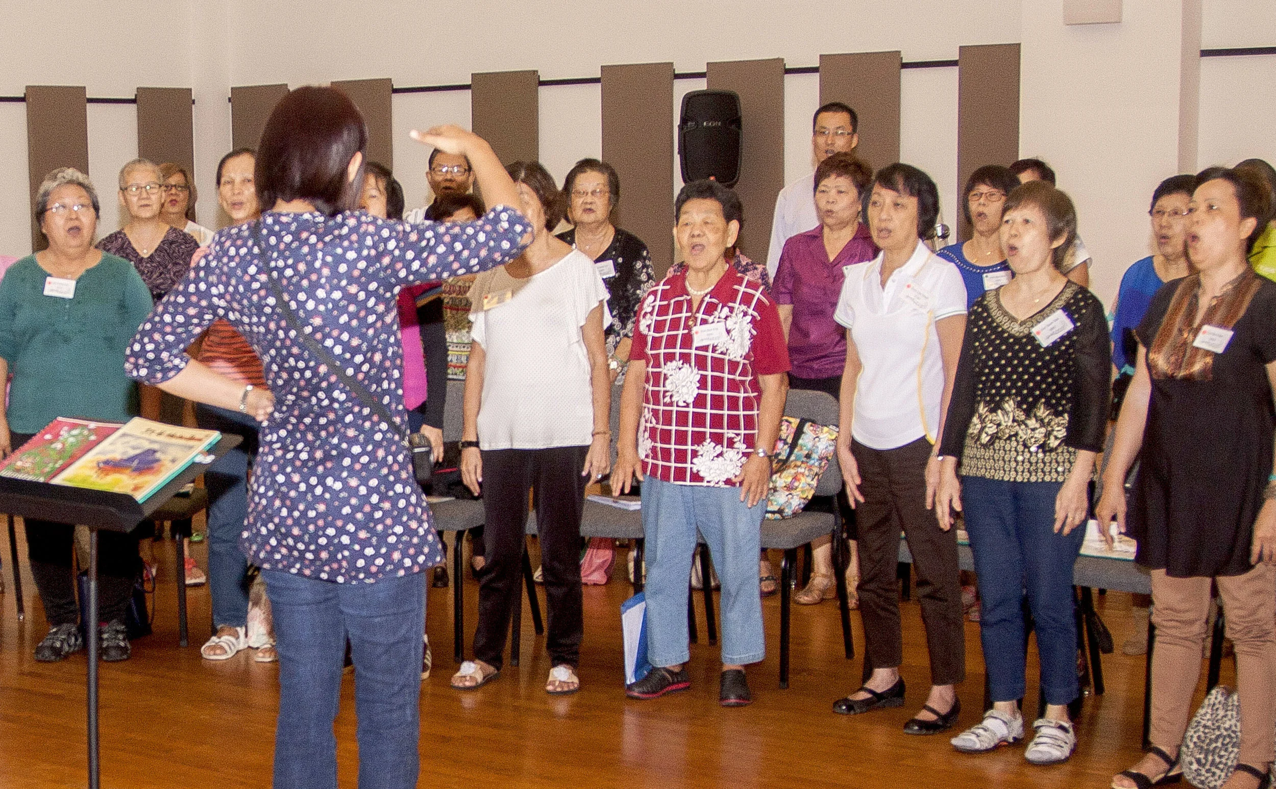 Above: Senior Citizens Choir, in association with NUS Society Choir and National University Health System (NUHS), rehearse in the YST Orchestra Hall.