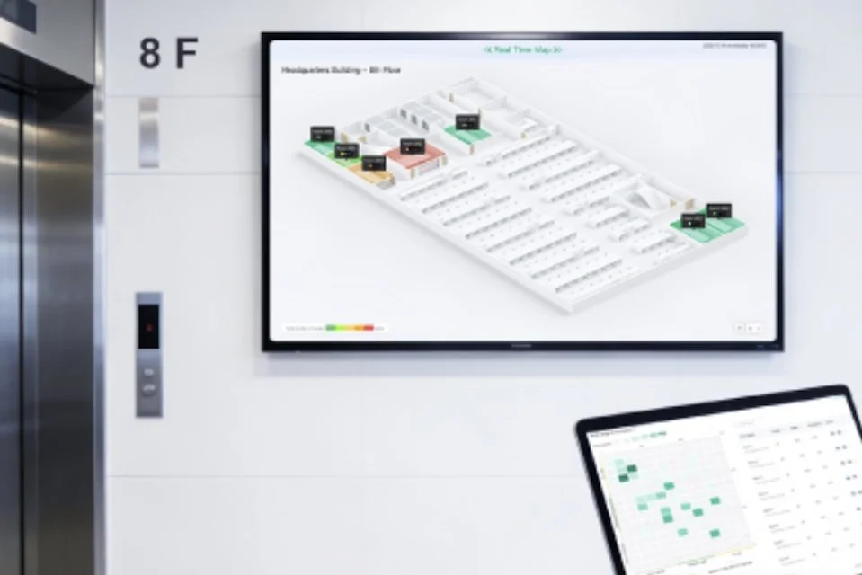 A TV displaying a wayfinding map showing meeting room locations