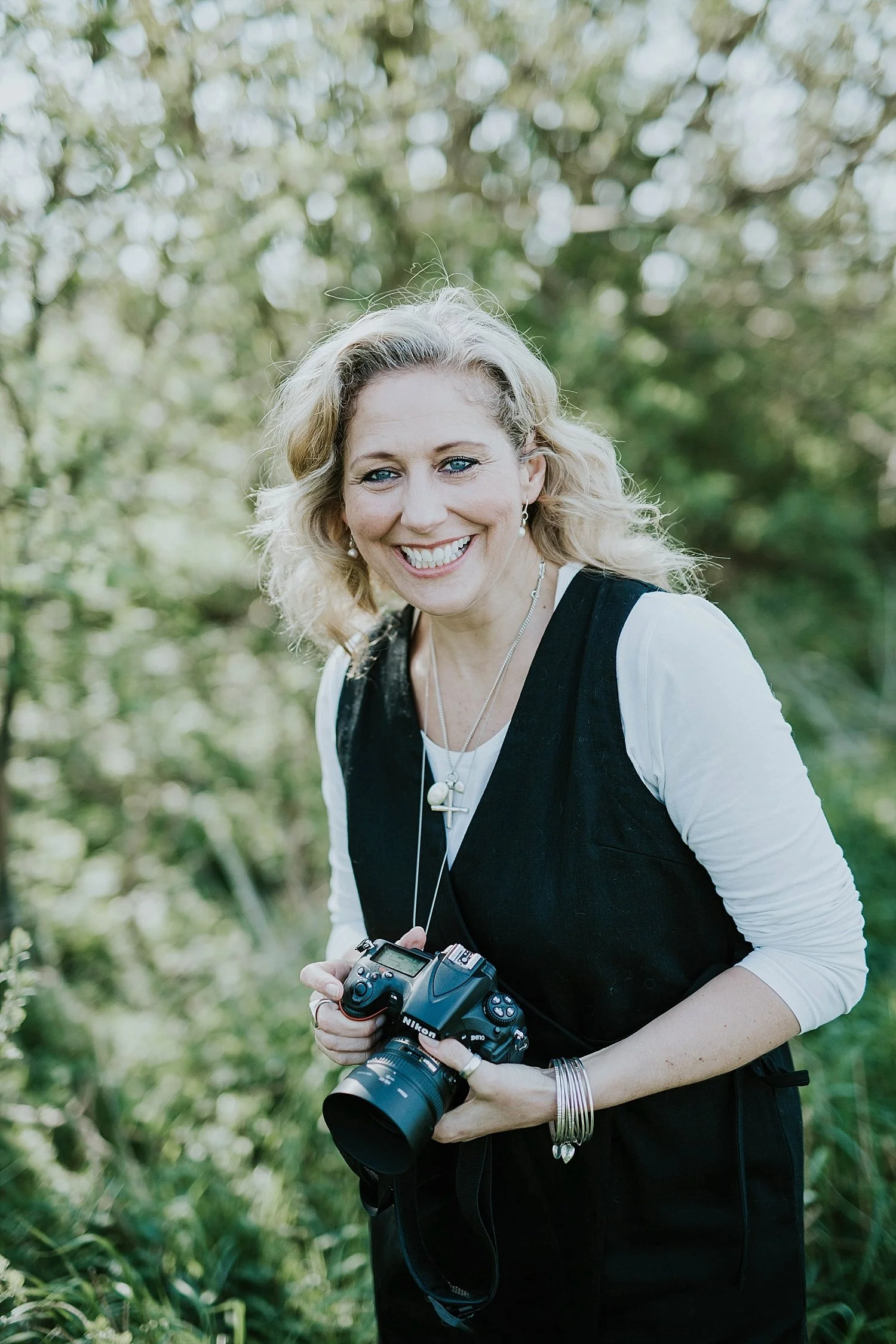 Neli Garnet, the talented wedding photographer behind most of our stunning portfolio imagery, known for her vibrant, beautifully detailed wedding photography that captures true emotions and helps couples relax in front of the camera on Aeroe island.