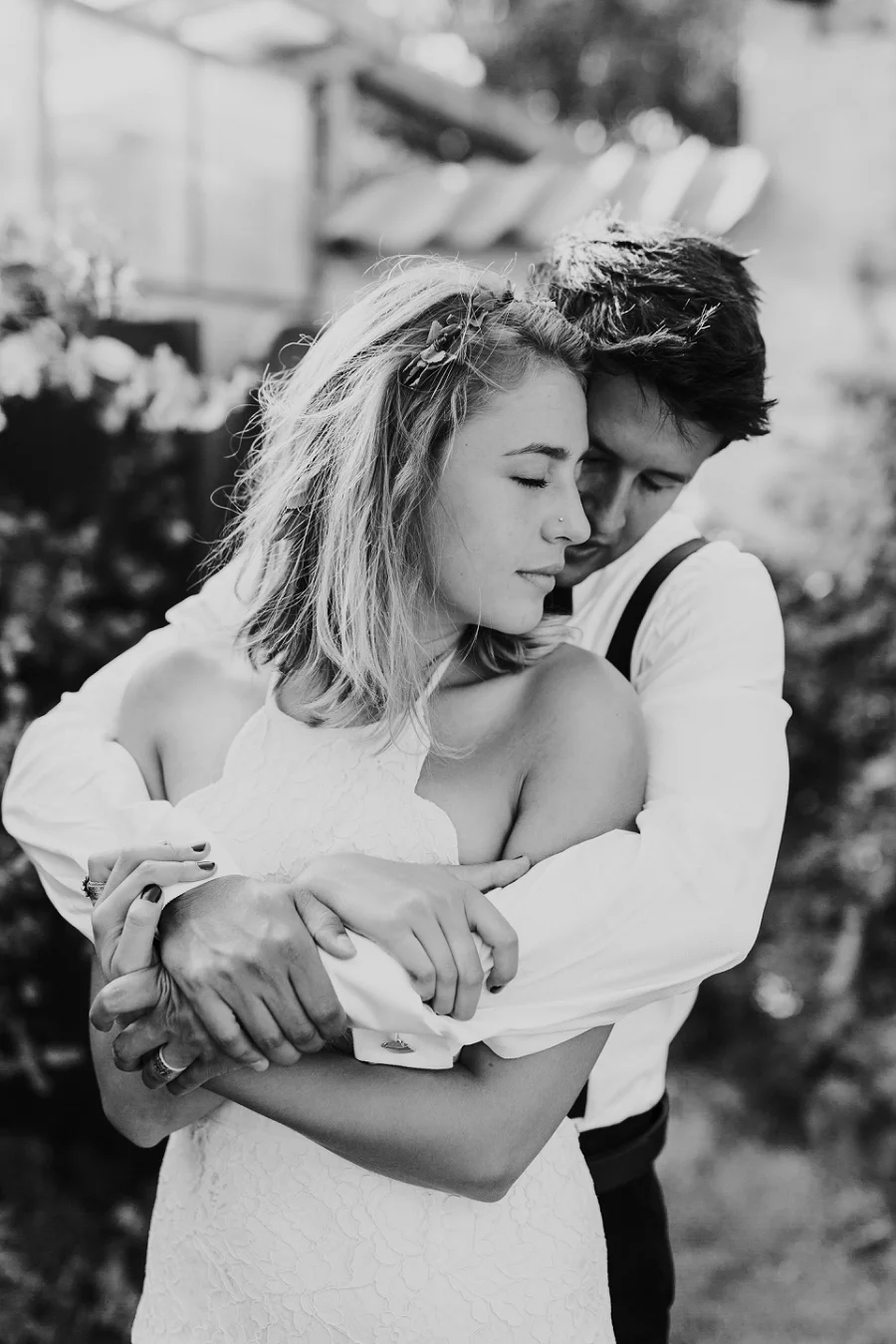 An international couple embracing during a quiet autumn wedding ceremony on the coast of Denmark, arranged by Danish Island Weddings.
