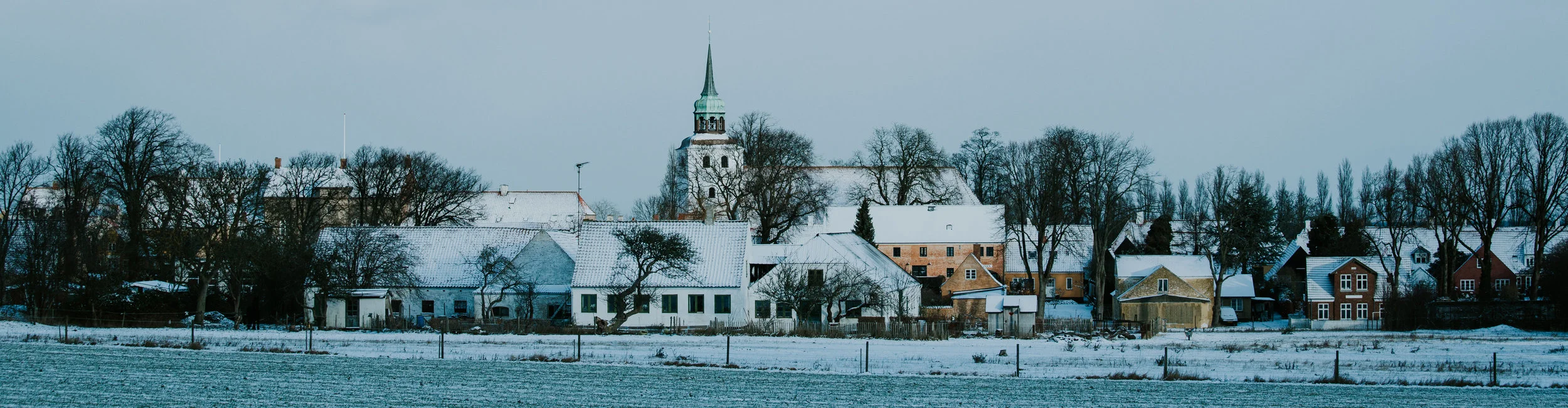 Colour panorama of a winter clad wedding town og Aeroeskoebing