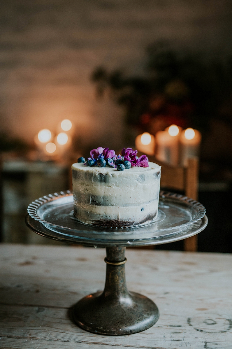 Rustic "naked" wedding cake with berries &amp; flowers | full-service destination wedding | get married in Denmark | Aero Island | Danish Island Weddings | Denmark wedding planners and venue