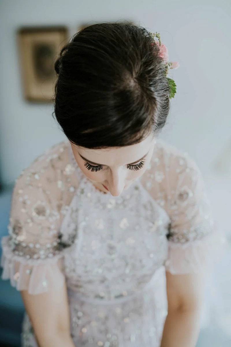 Bride with brown bridal updo and sequin wedding dress in The Old Merchants House Aeroeskobing