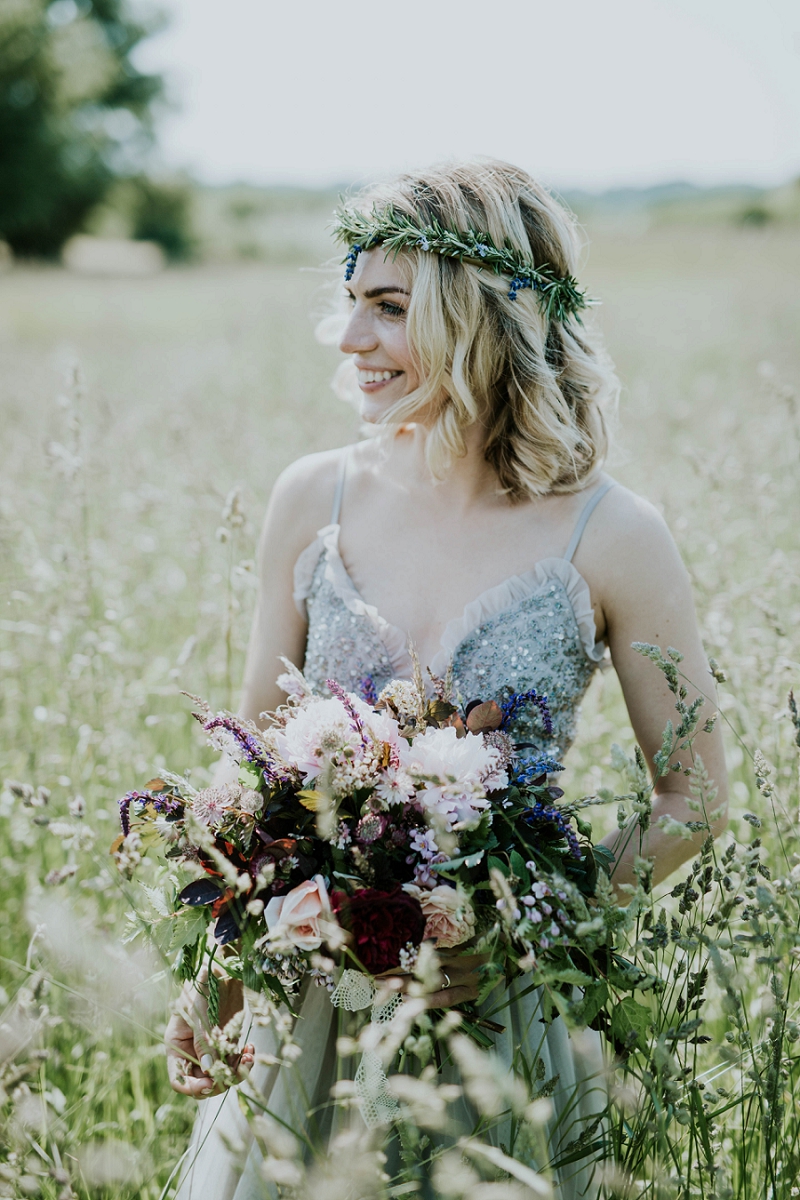 Blonde bride with lavender flower crown and wedding bouquet on Aeroe island