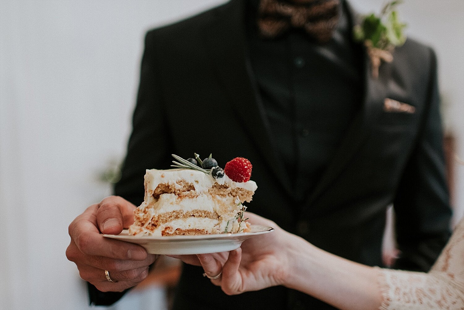 serving cake at winter elopement wedding reception in denmark
