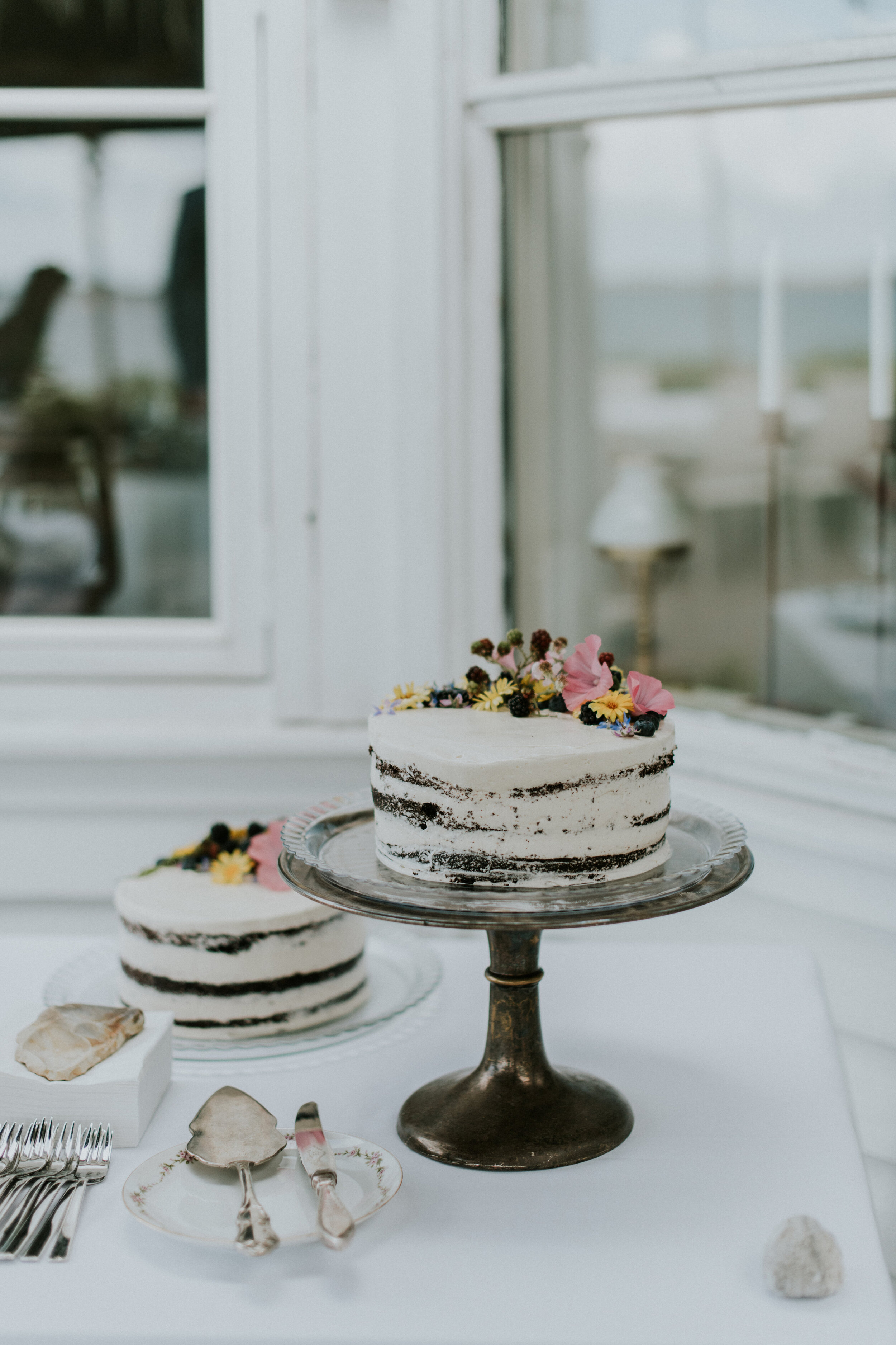 Rustic “naked” wedding cake with berries &amp; flowers | full-service destination wedding | get married in Denmark | Aero Island | Danish Island Weddings | Denmark wedding planners and venue