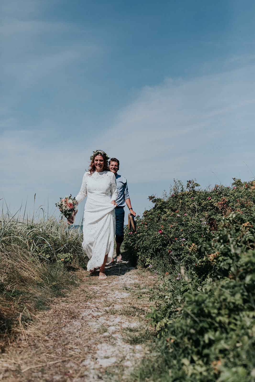 bride and groom at beach wedding ceremony - aero island, denmark - european destination wedding planned by danish island weddings