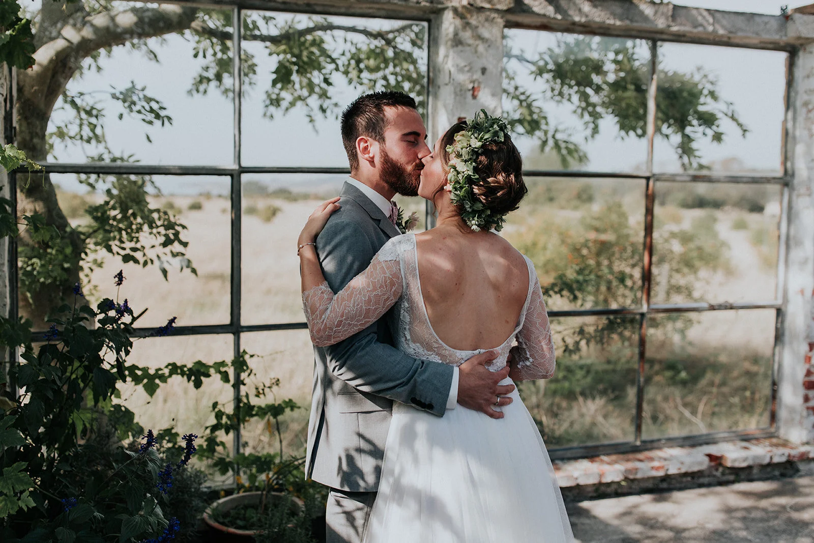 Newlywed couple embracing at an outdoor mini wedding venue on a Danish island