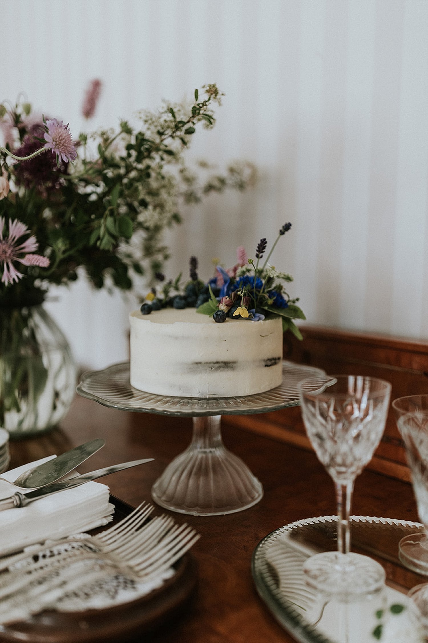 rustic wedding cake with flowers | full-service destination wedding | get married in Denmark | Aero Island | Danish Island Weddings | Denmark wedding planners and venue