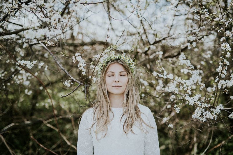 Wedding flowers by Danish Island Weddings | bride in trees with floral crown | Denmark wedding planners and florist