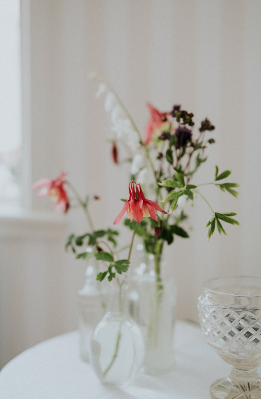 red white and green stems in small vase trio  | Danish Island Weddings | Full service Denmark wedding planners