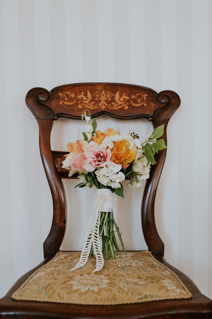 Wedding flowers on vintage chair