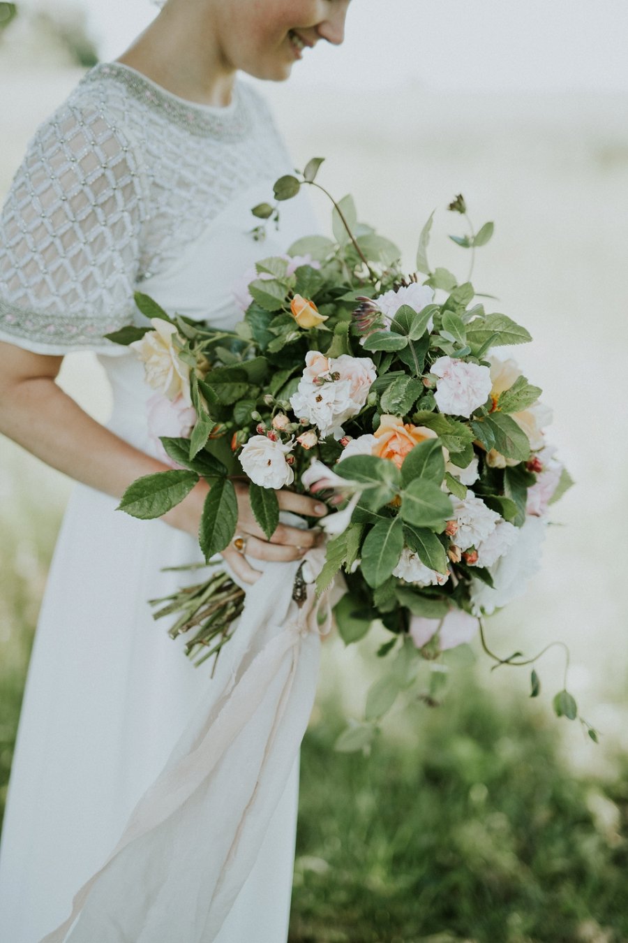 bride with informal casual wedding dress carrying modern wedding bouquet | Aero Island | Danish Island Weddings | Full service Denmark wedding planners