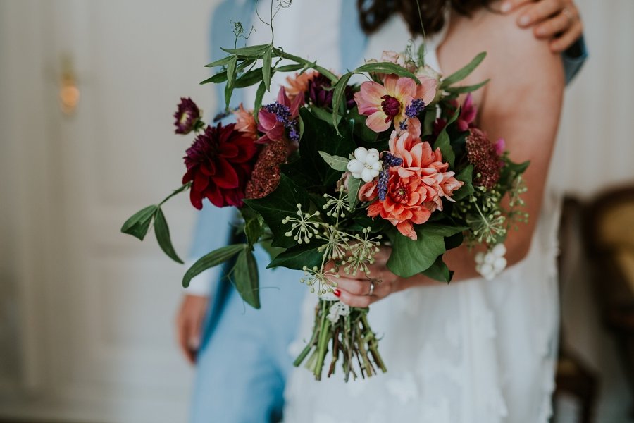 modern fall wedding bouquet with red orange peach green | Get married abroad | Aero Island | Danish Island Weddings | Full service Denmark wedding planners