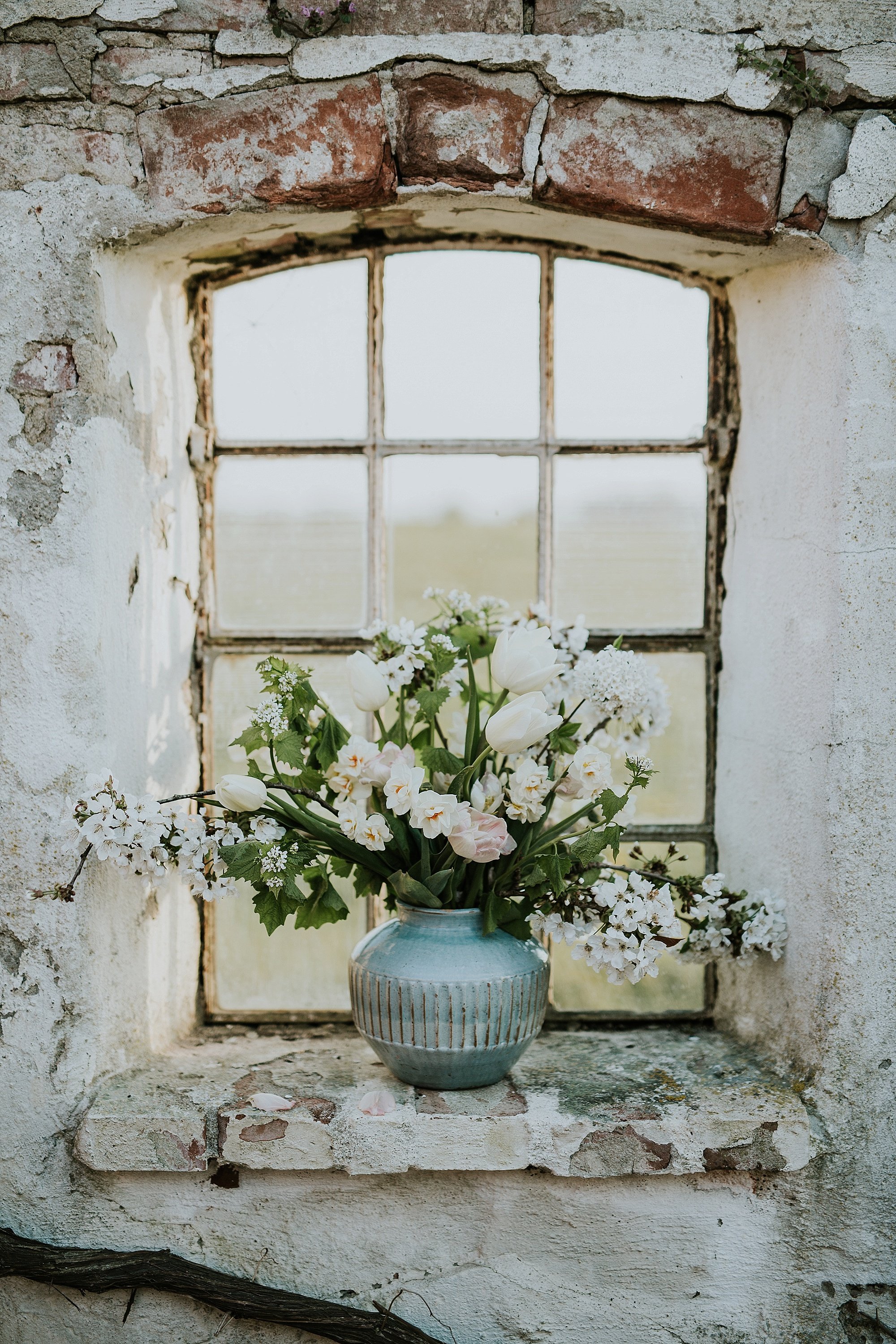 bouquet in vase on stone window ledge | Denmark wedding planners and florist