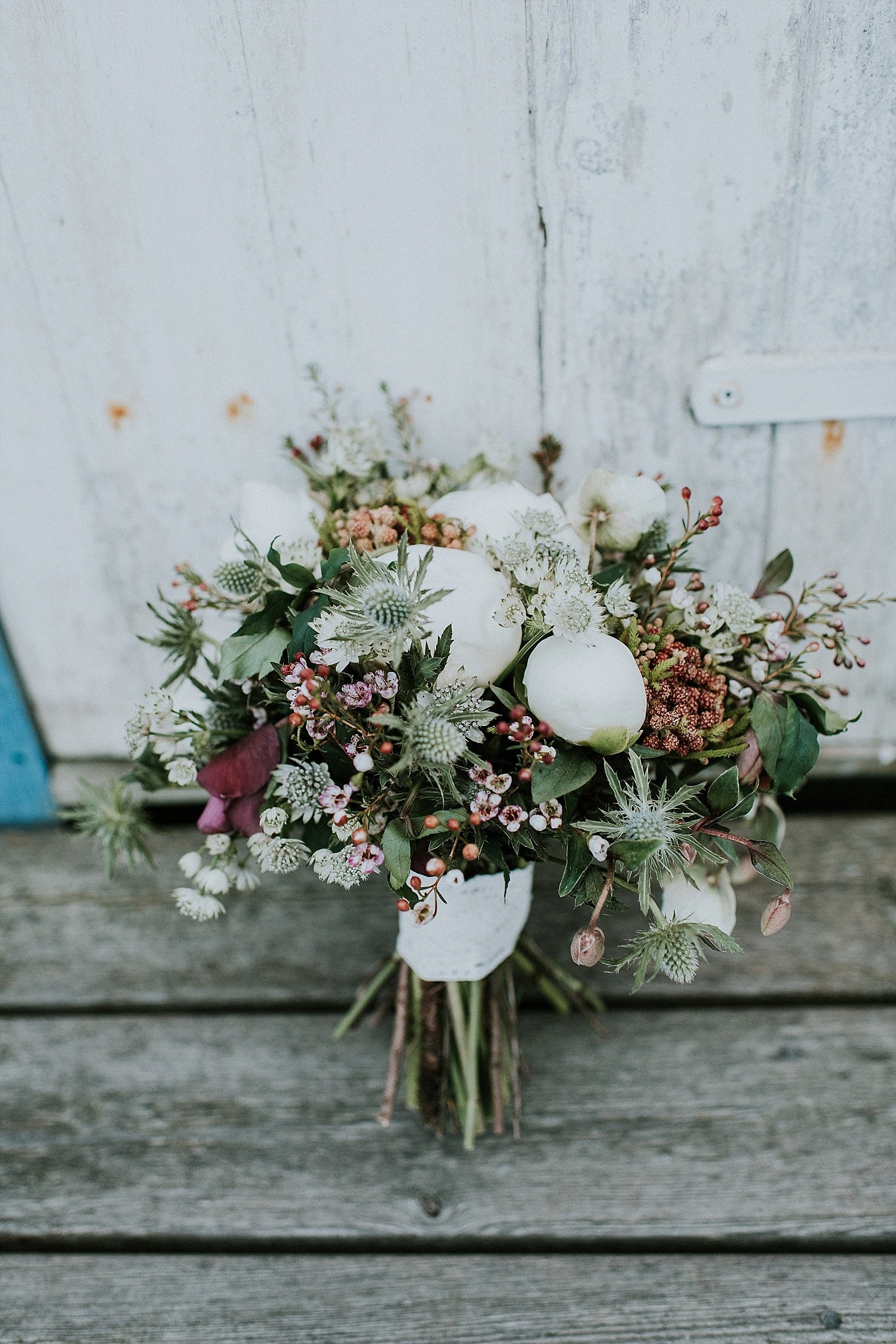 winter wedding bouquet on steps | winter wedding | destination wedding | get married in Denmark | Aero Island | Danish Island Weddings