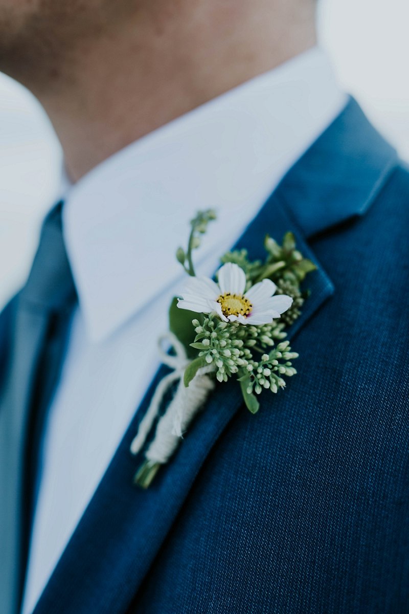 simple white daisy boutonniere | Aero Island | Danish Island Weddings | Full service Denmark wedding planners