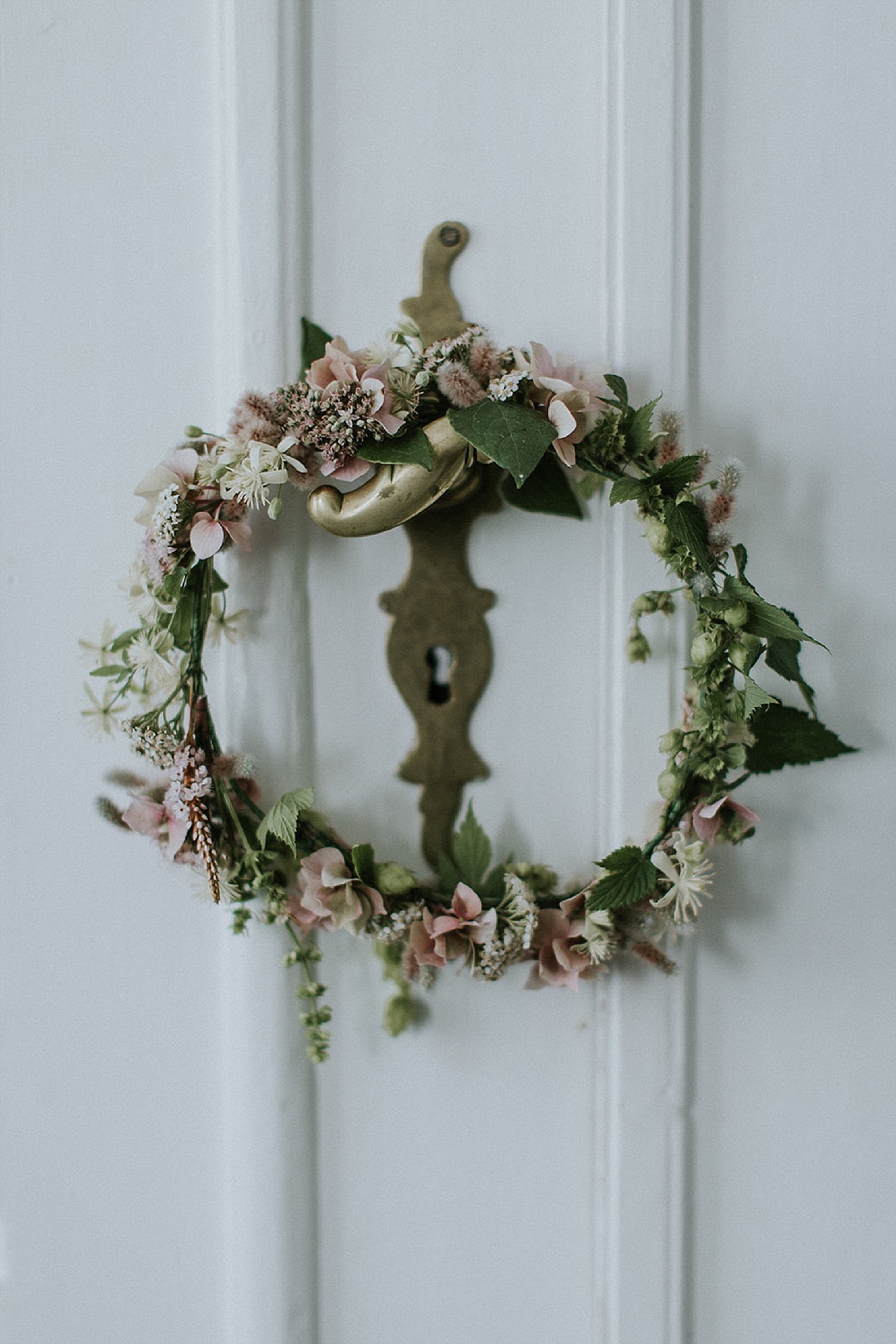floral ring on doorknob | Aero Island | Danish Island Weddings | Full service Denmark wedding planners