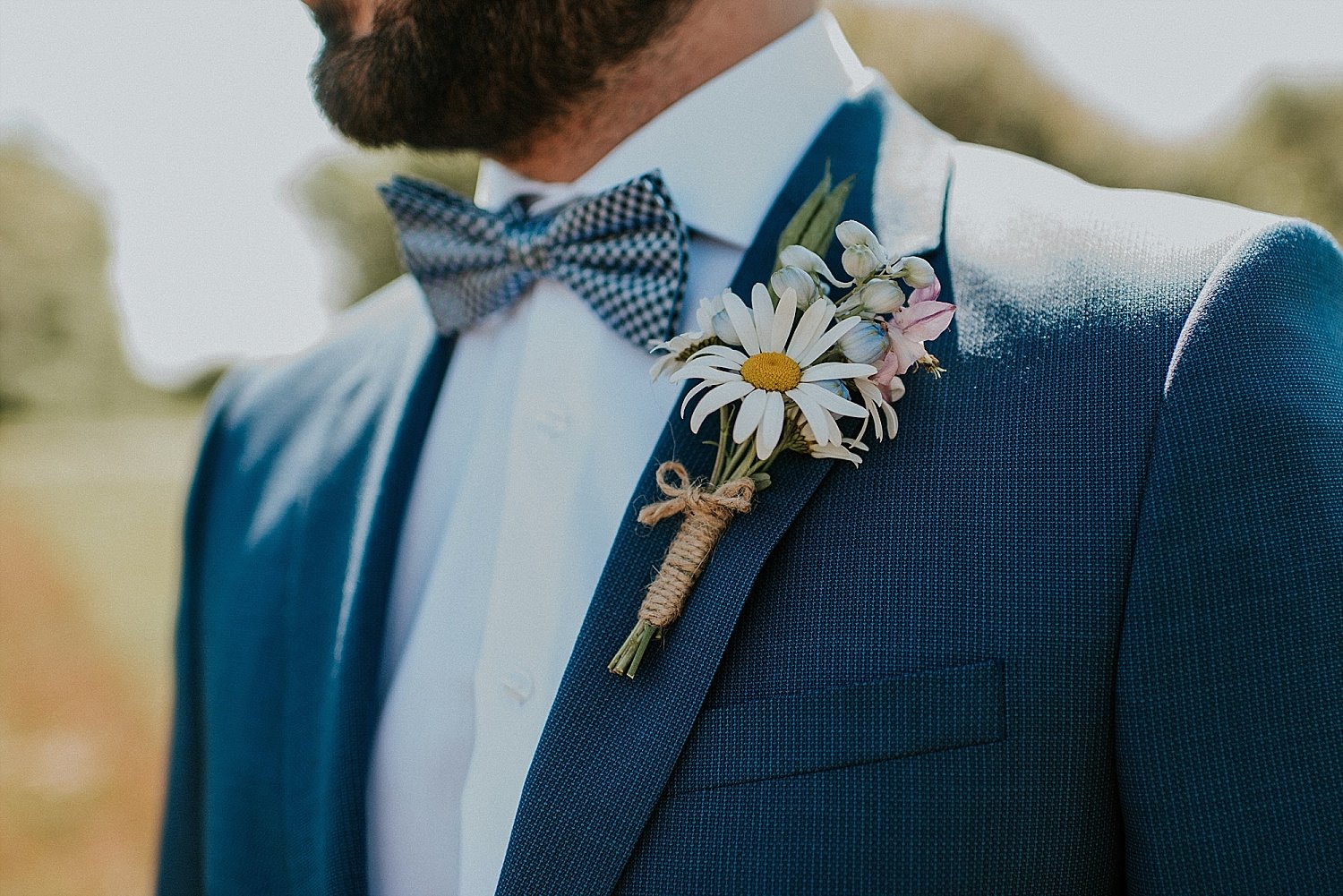 Groom in suit with boutonniere