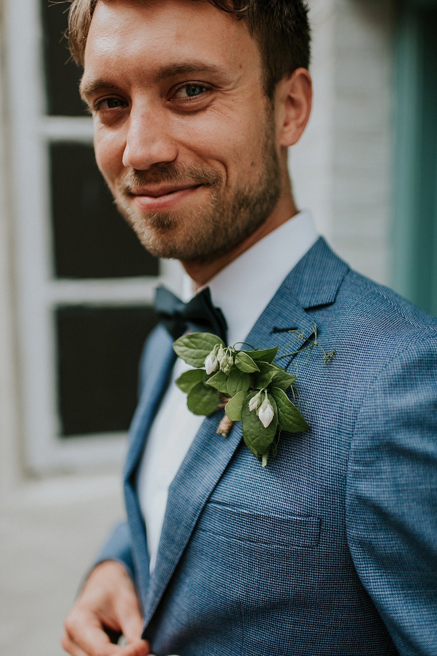 Smiling groom with boutonniere