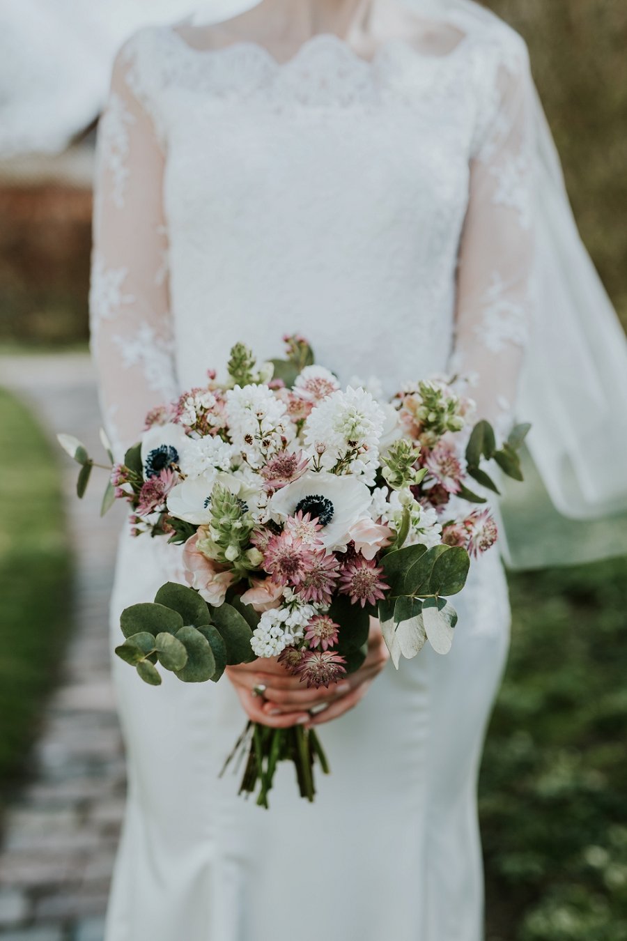 bride with bouquet of green white pink burgundy flowers | Denmark wedding planners and florist