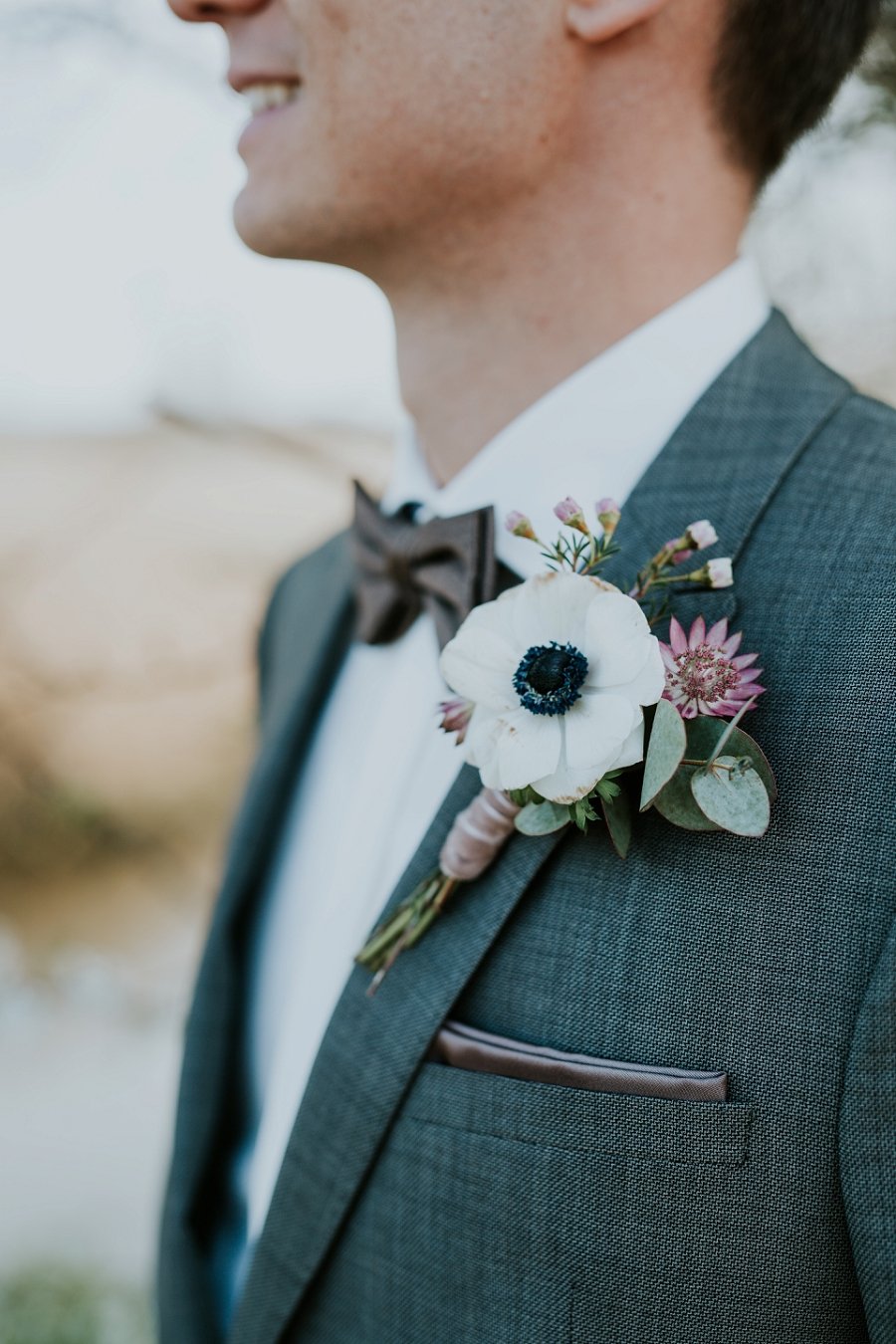groom with floral boutonniere | Denmark wedding planners and florist