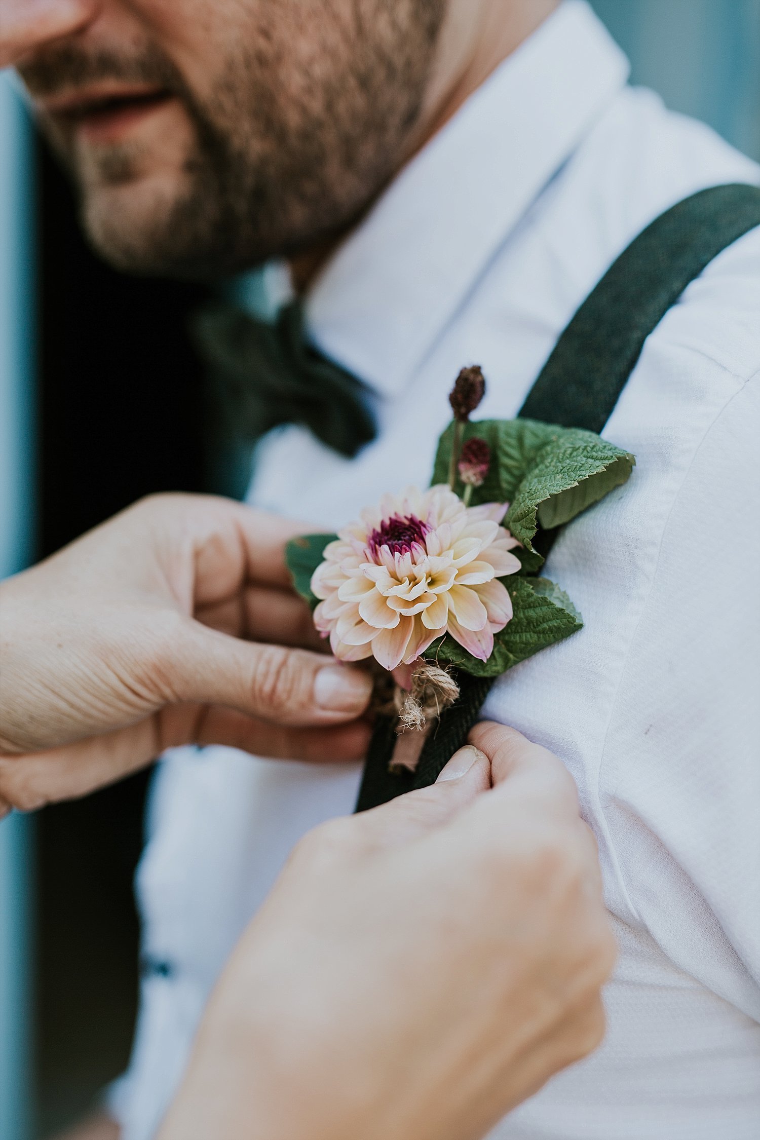 Helping groom with boutonniere