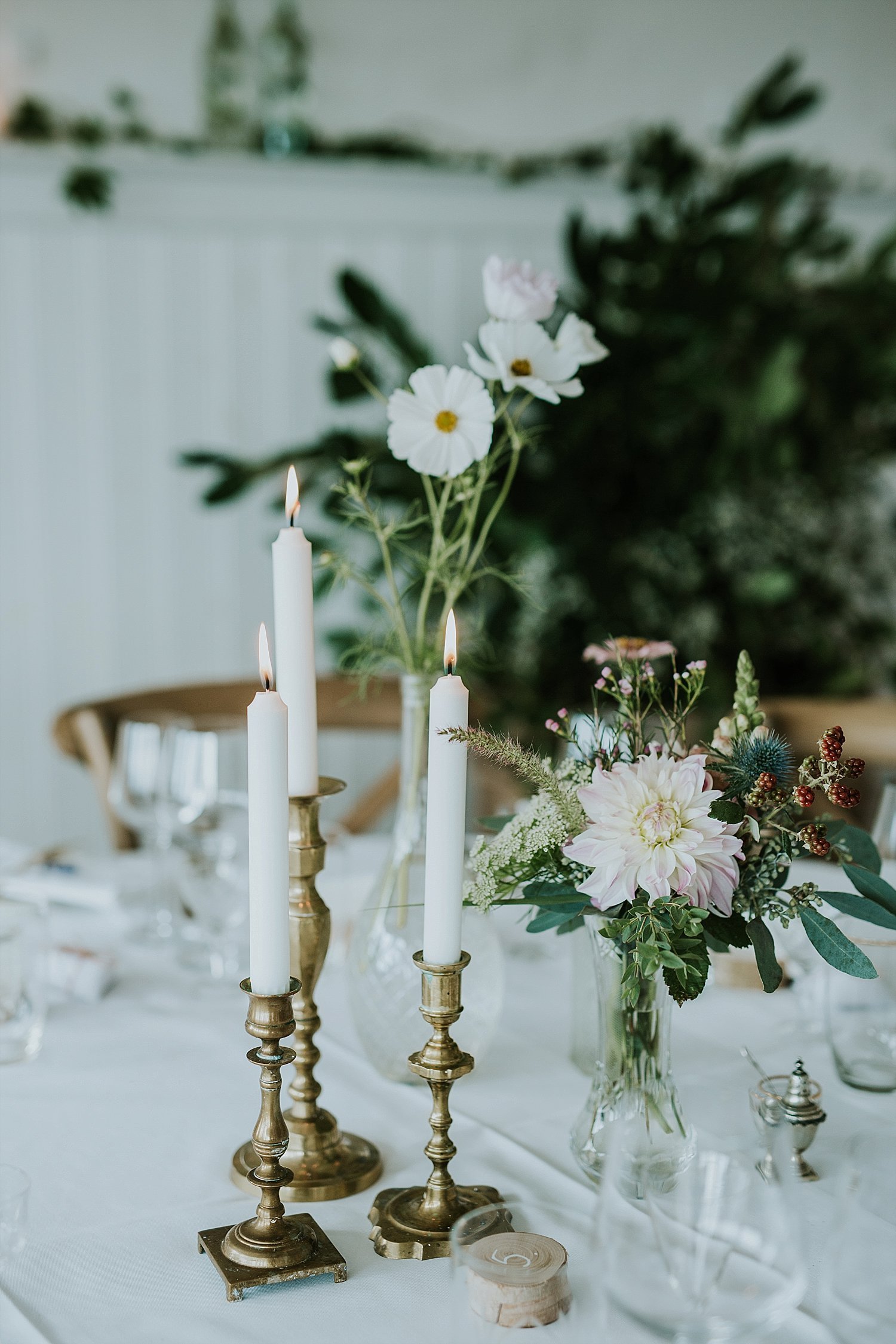 flowers and candles on table