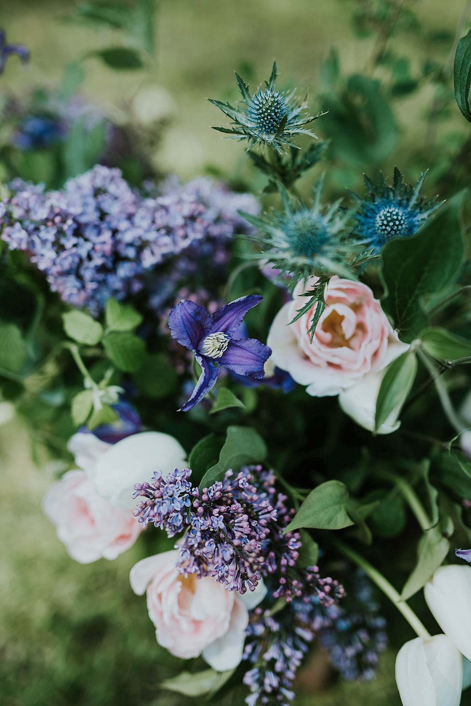 Wedding bouquet with pink, blue, purple flowers