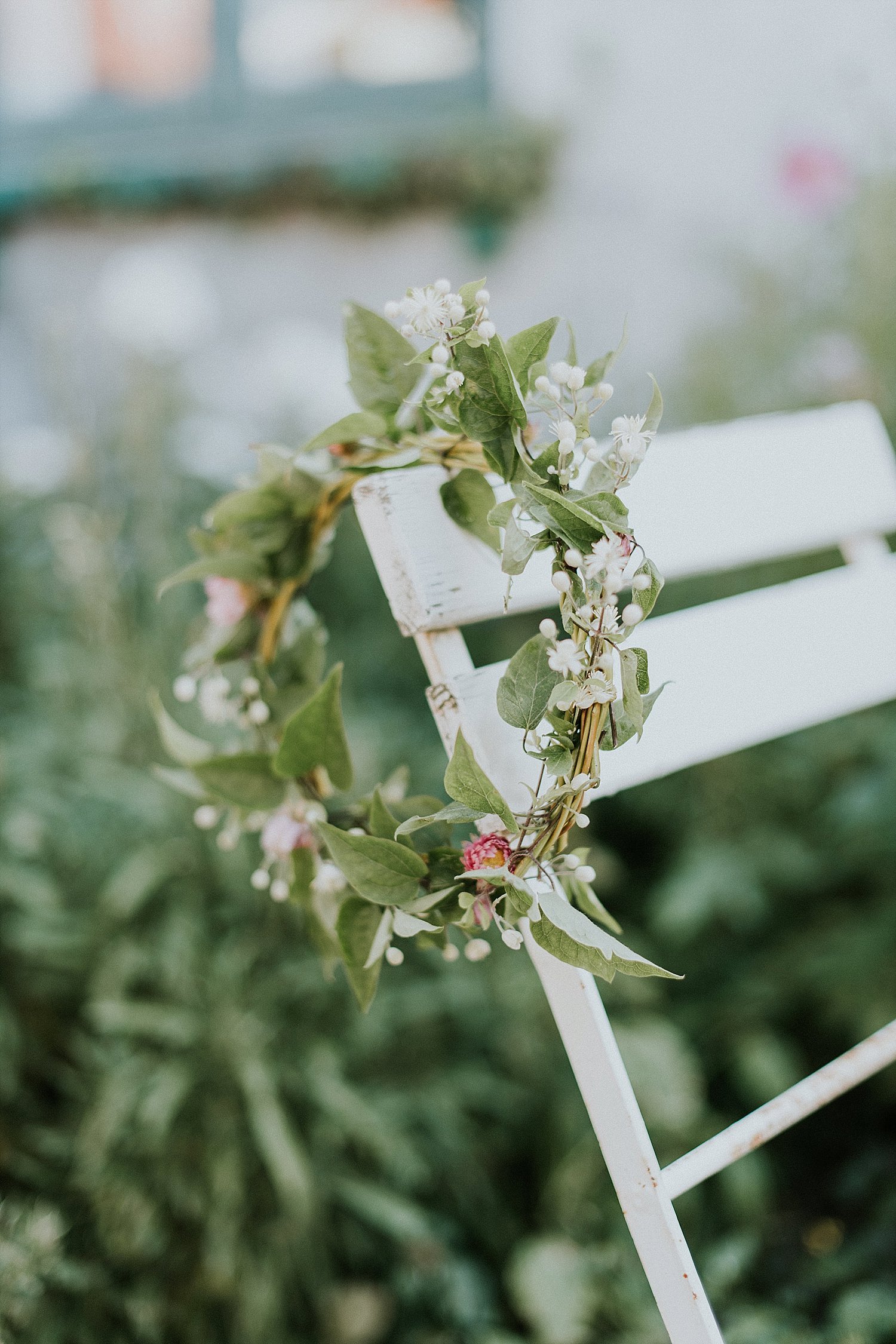 floral wring on chair at wedding | Danish Island Weddings | Full service Denmark wedding planners