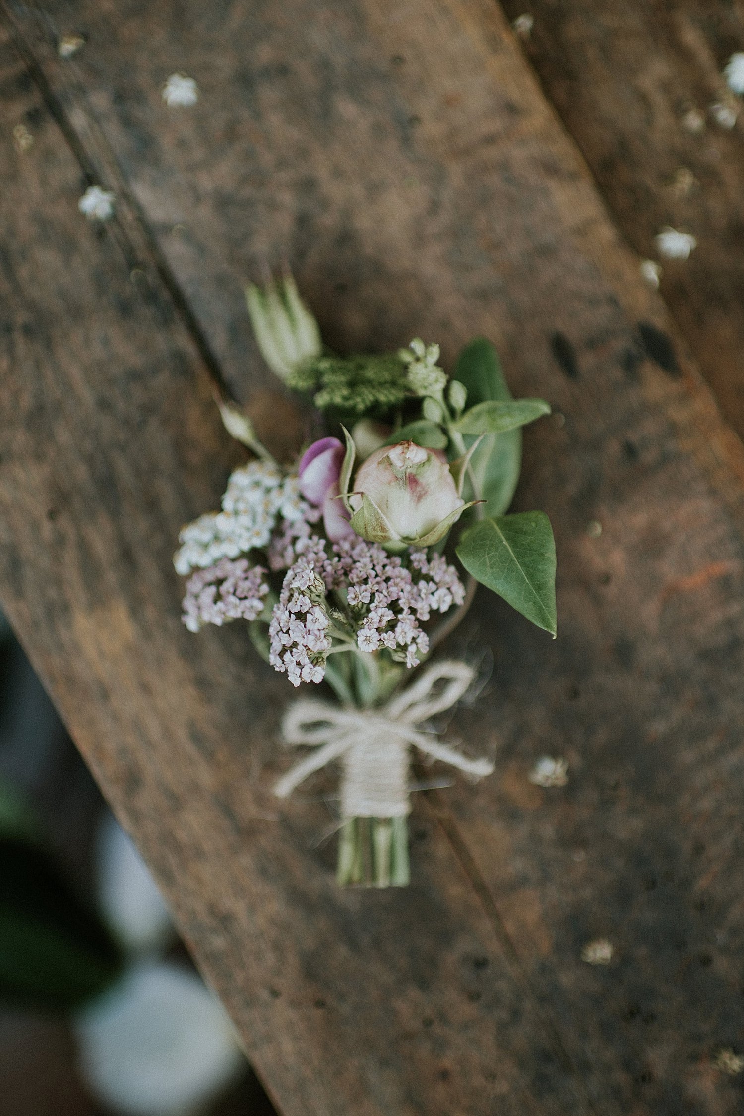 Groom's boutonniere on weathered table 