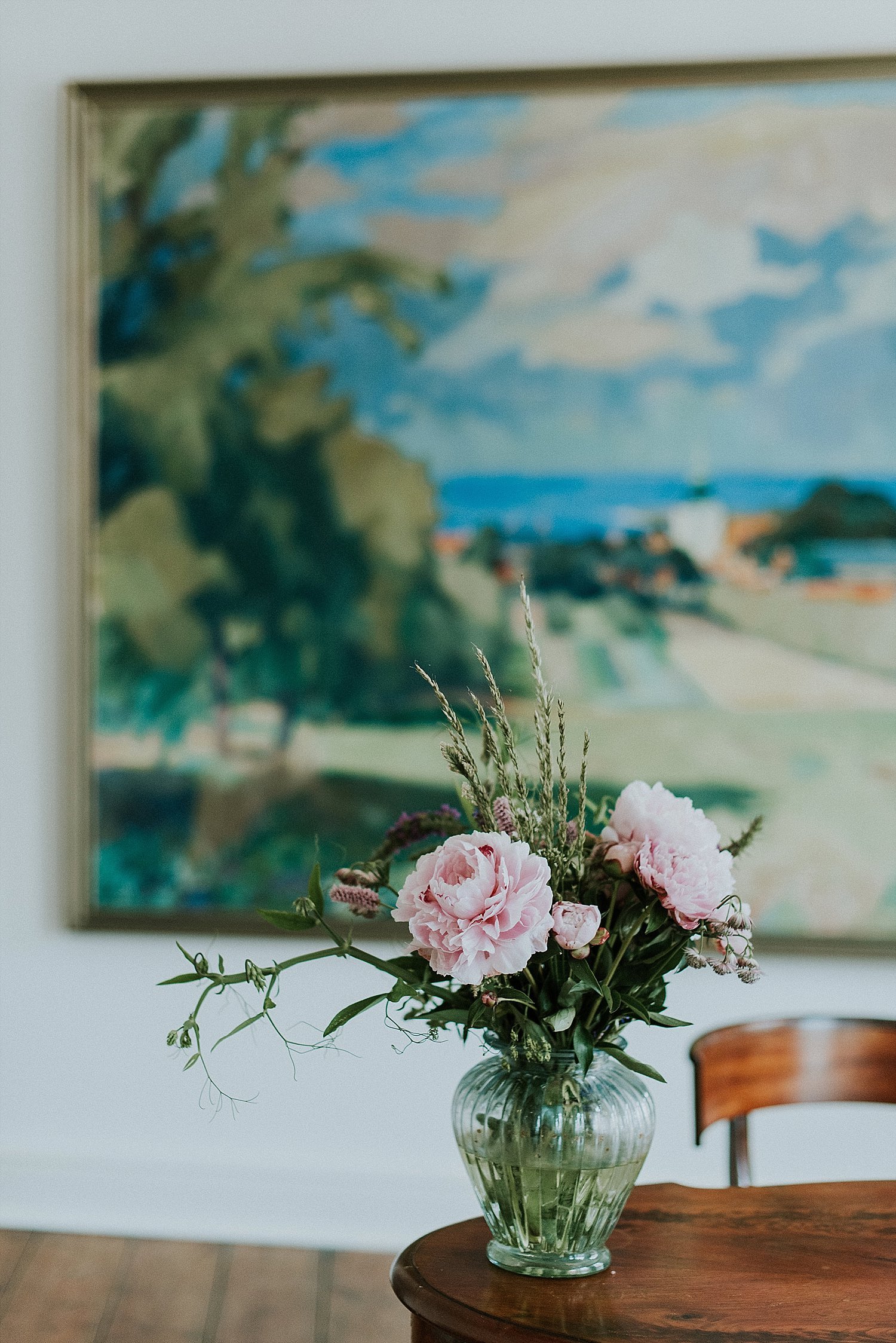 small pink floral bouquet in vase on table | Aero Island wedding planners | Denmark weddings and florists