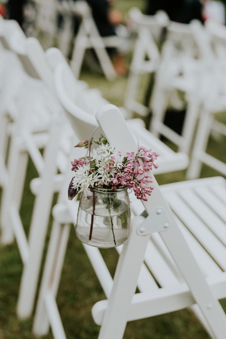 small jar of pink and white flowers aisle marker | Aero Island wedding planners | Denmark weddings and florists