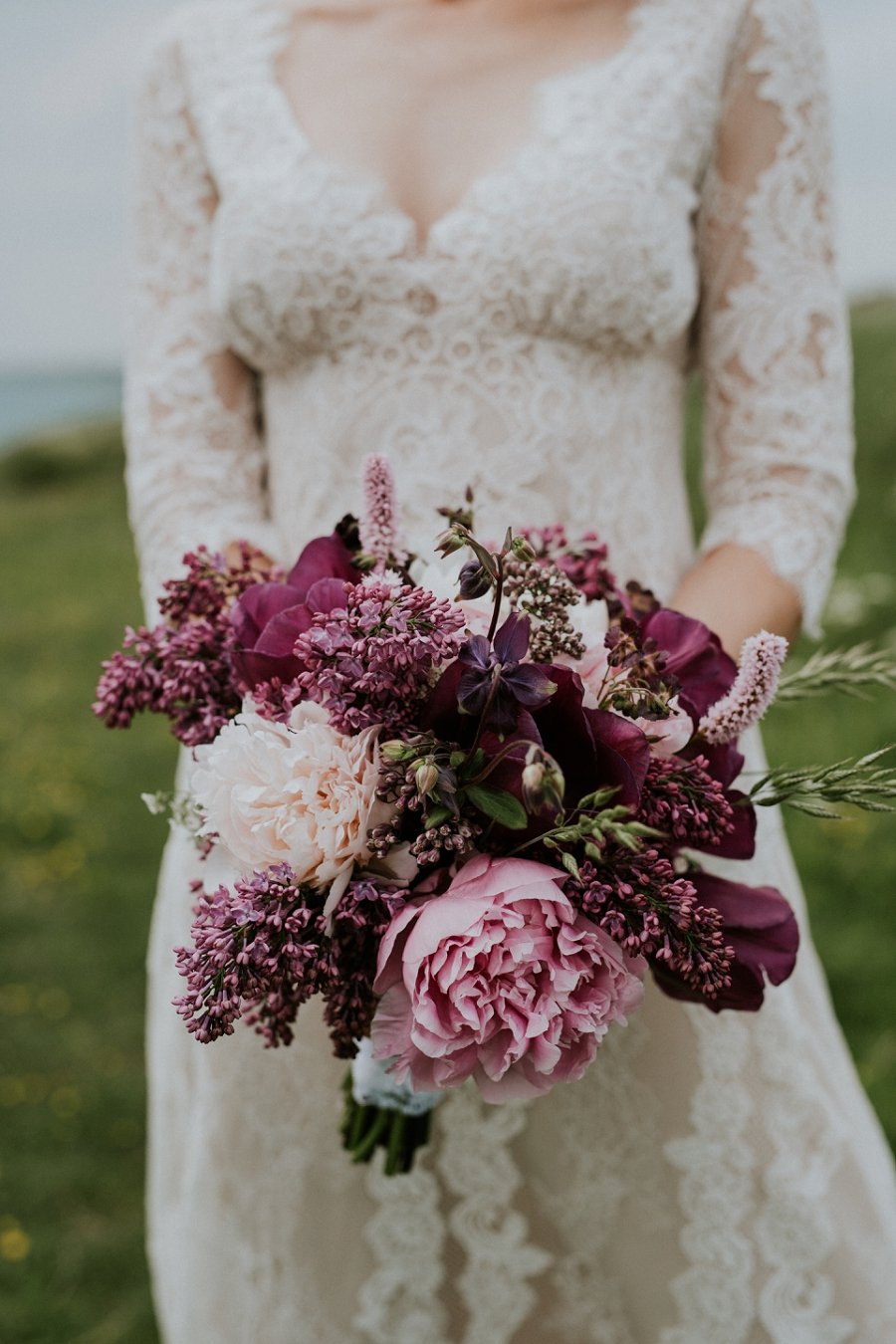 bride with bouquet of pink and burgundy flowers | Denmark wedding planners and florist