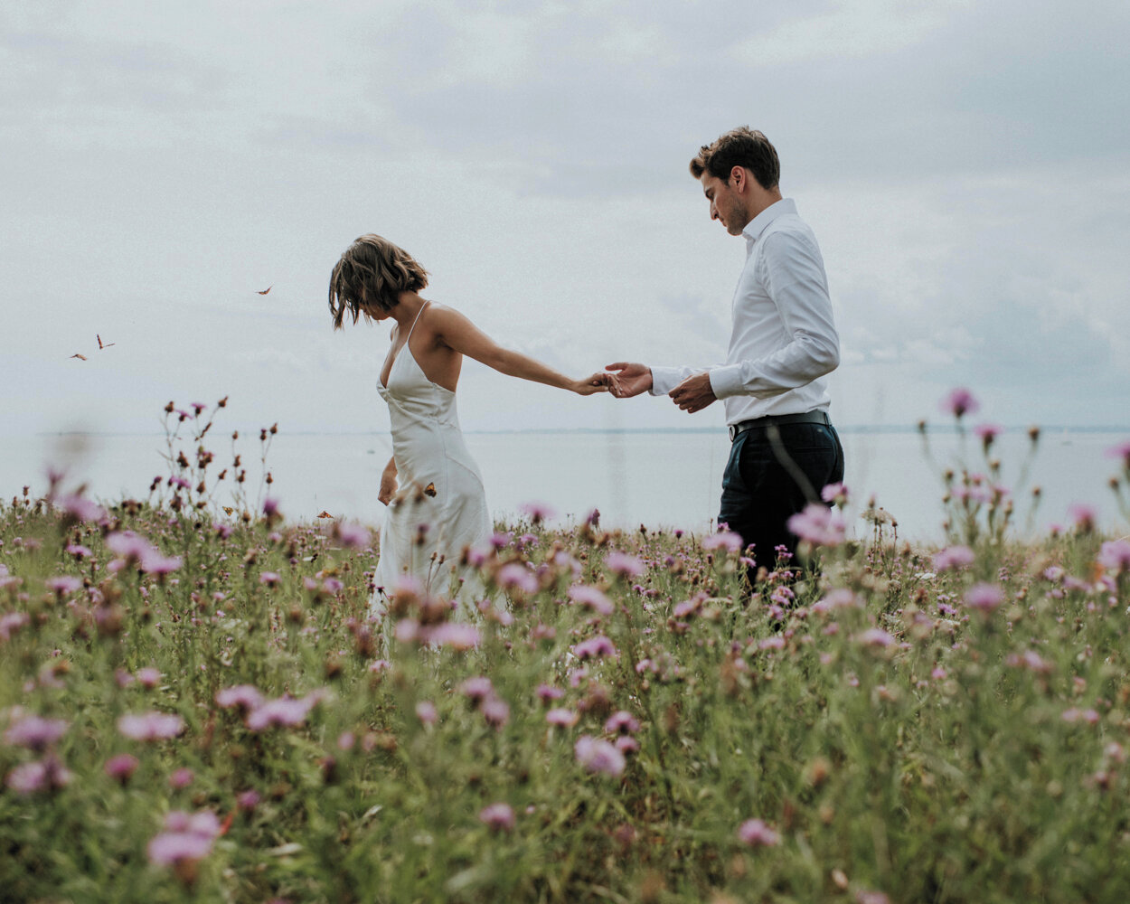 Autumn is just around the corner, so let's frolick in butterfly filled fields of wildflowers while they last.⁣
One of my favourite shots of all time by our fabulous photographer @neligarnet 😍⁣
#wildflowerwedding #elopement #elopetodenmark #&aelig;r&