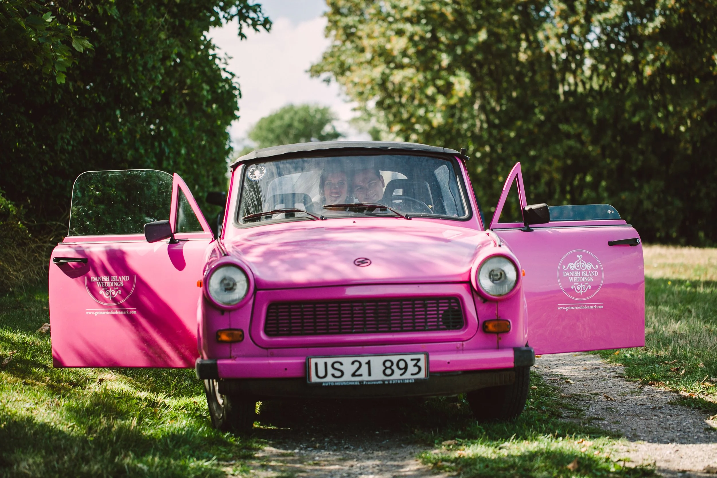 The iconic vintage pink Trabant wedding car used for micro weddings on Aeroe Island, provided by Danish Island Weddings