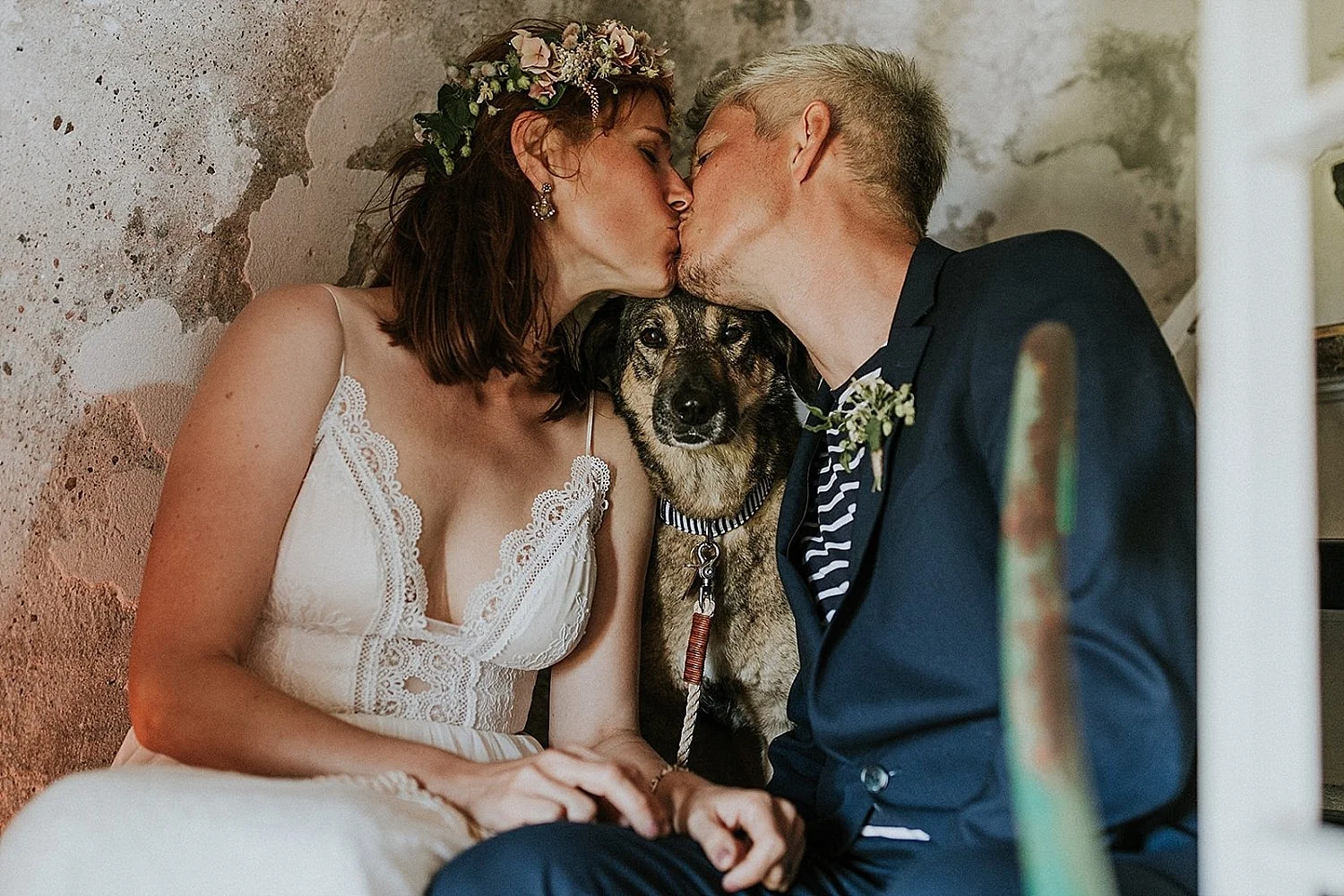 Couple celebrating a dog-friendly elopement wedding in a Danish lighthouse, perfect for international couples marrying in Europe.