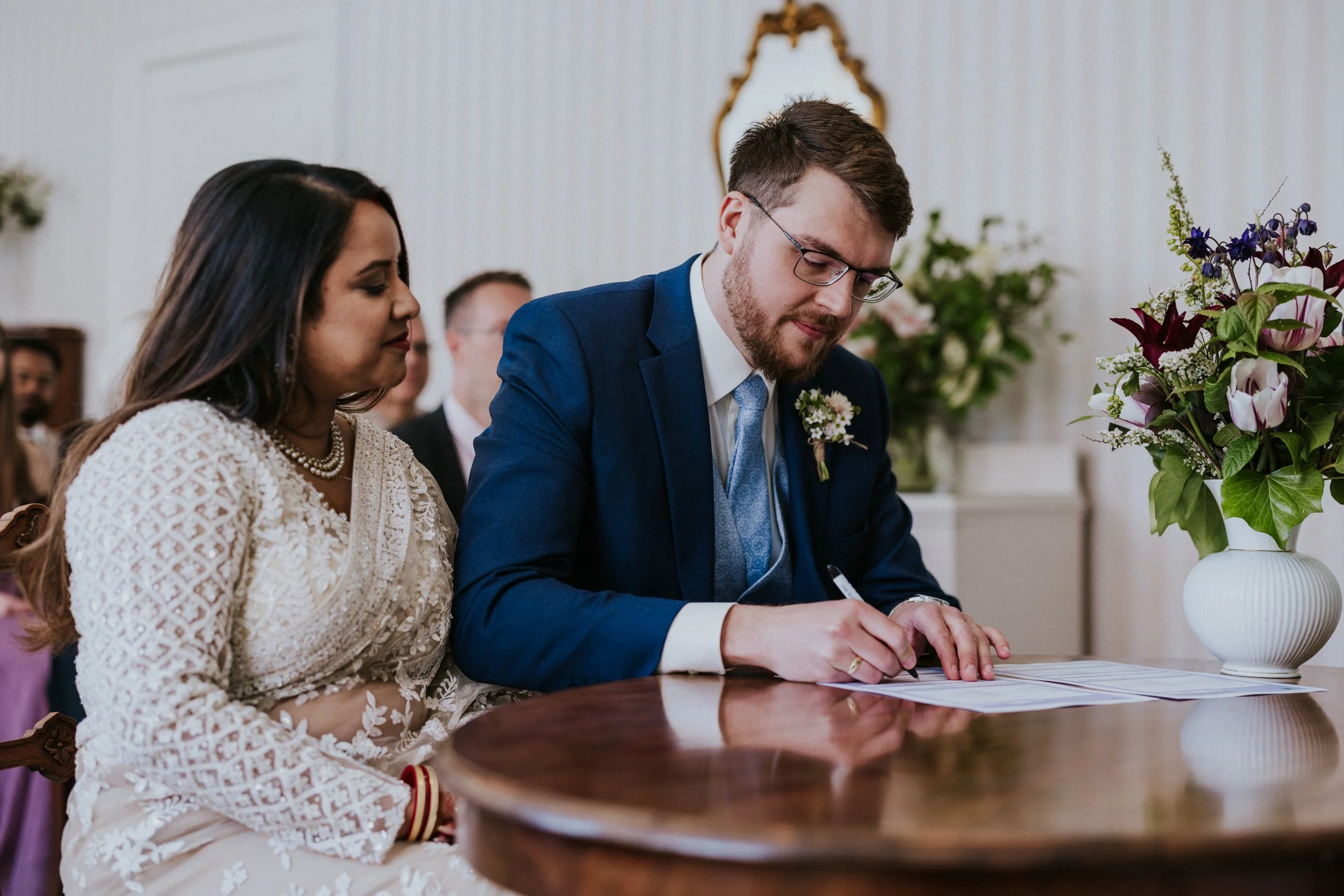 signing-marriage-documents-denmark-wedding