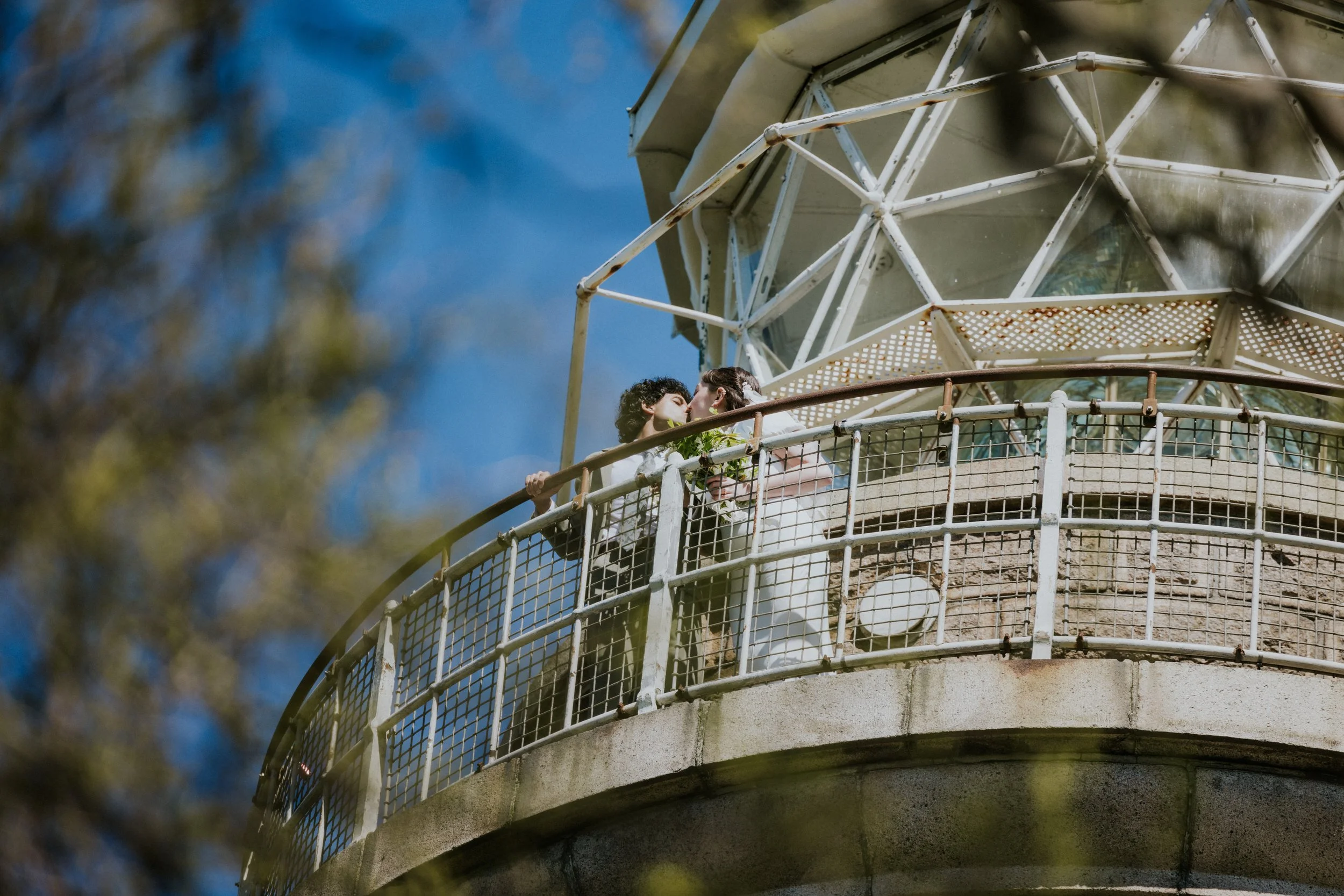 bride-groom-lighthouse-balcony-blue-sky