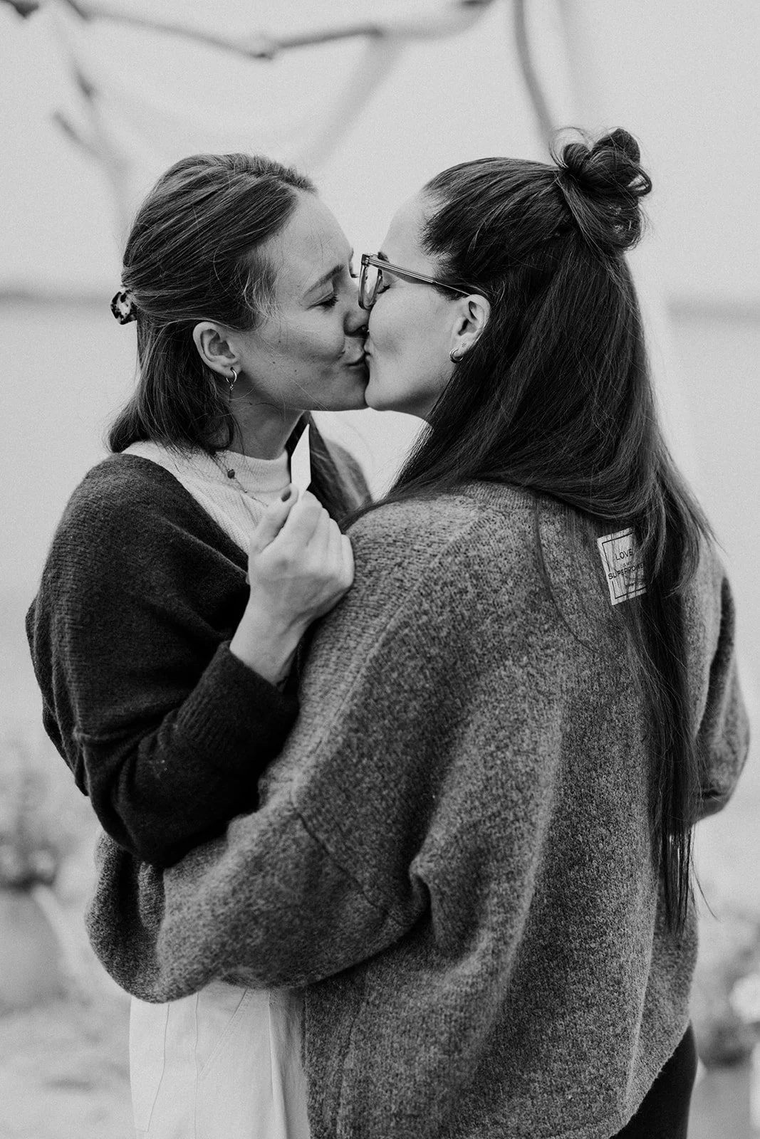 intimate black and white photo of lesbian wedding kiss denmark