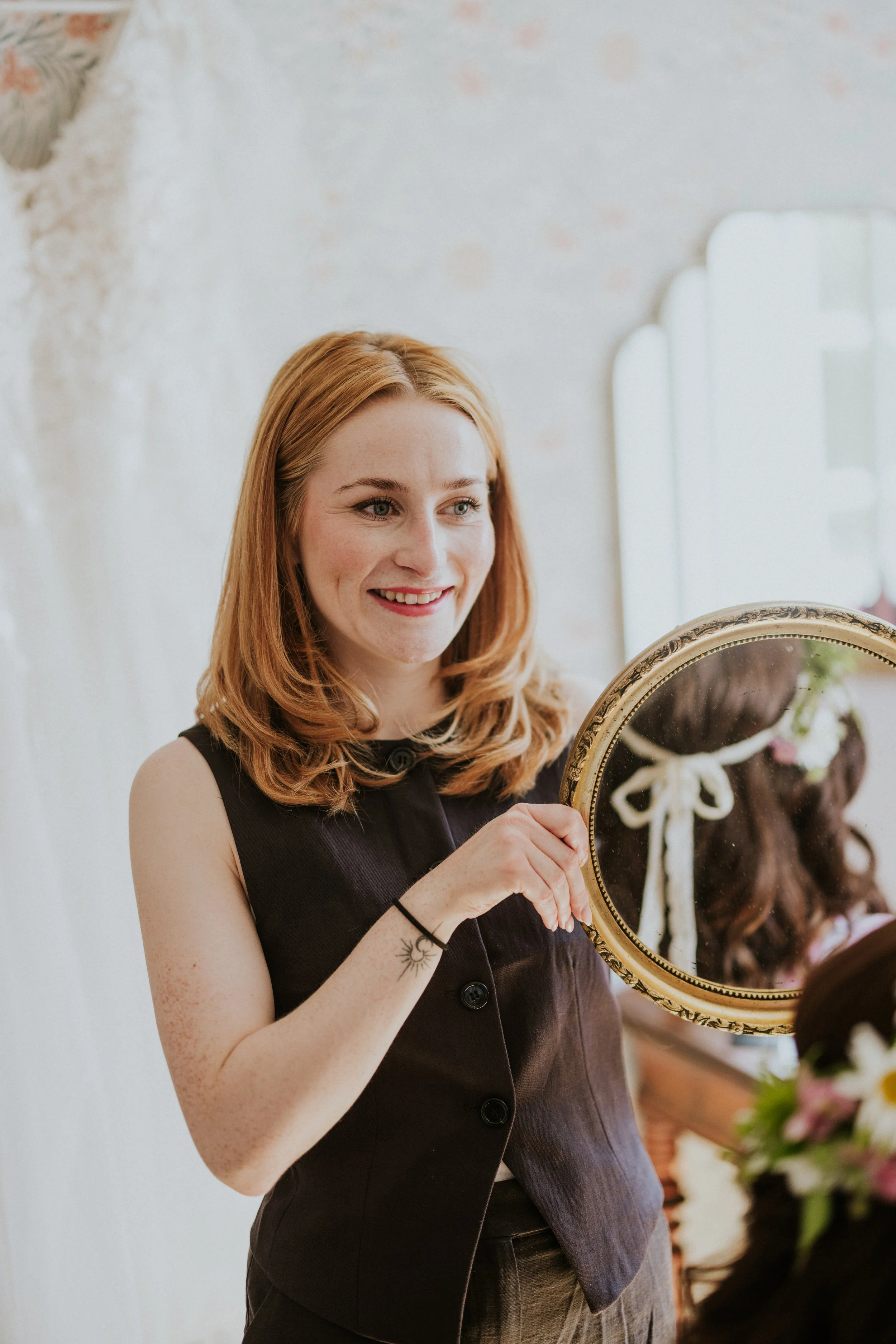 Augusta Egidia, our expert bridal hair and makeup artist, crafting a stunning, natural look tailored to the bride's wishes in a relaxing, comfortable environment before an intimate destination wedding with Danish Island Weddings.