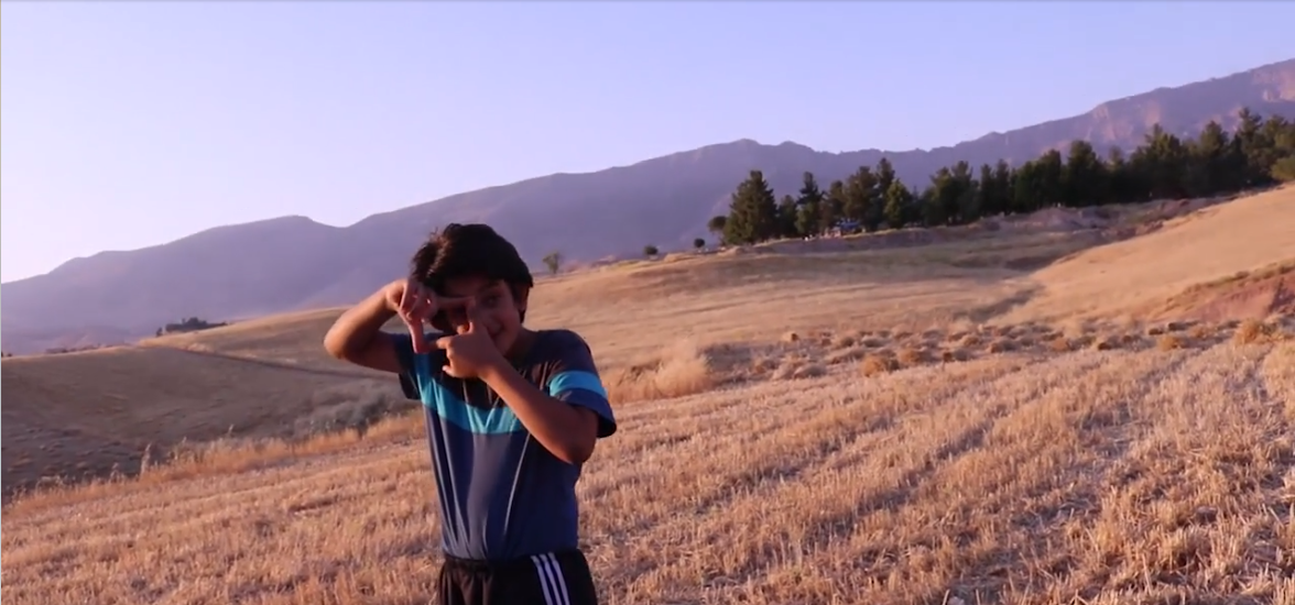 Opening-A boy with a movie camera.png