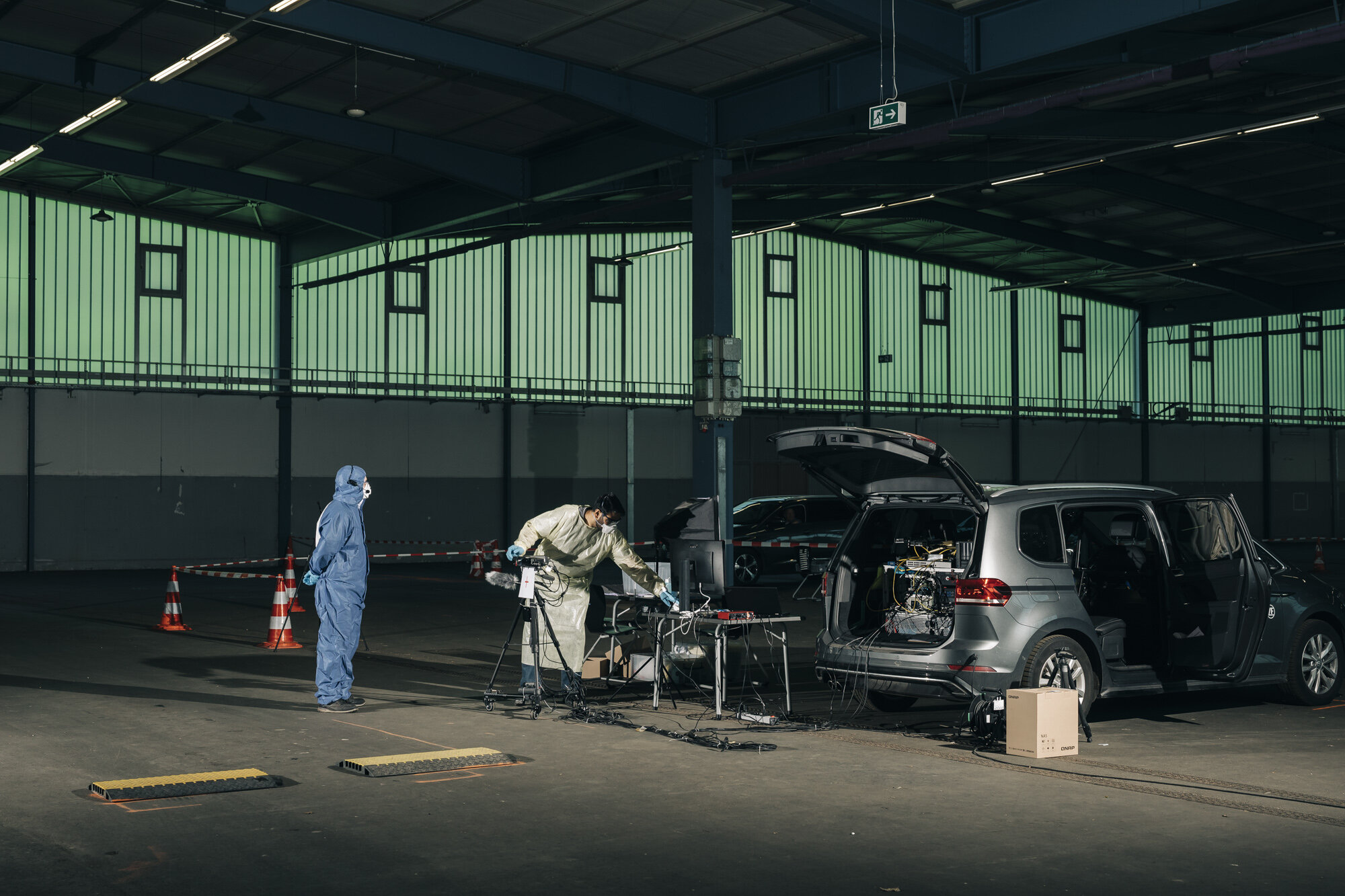 Researchers Tobias G. and Mayur J. are investigating at the Covid-19 drive-in test station at the Saarbrücken Exhibition Centre to determine whether Covid-19 symptoms can also be detected without contact. After people have been gestured by a doctor