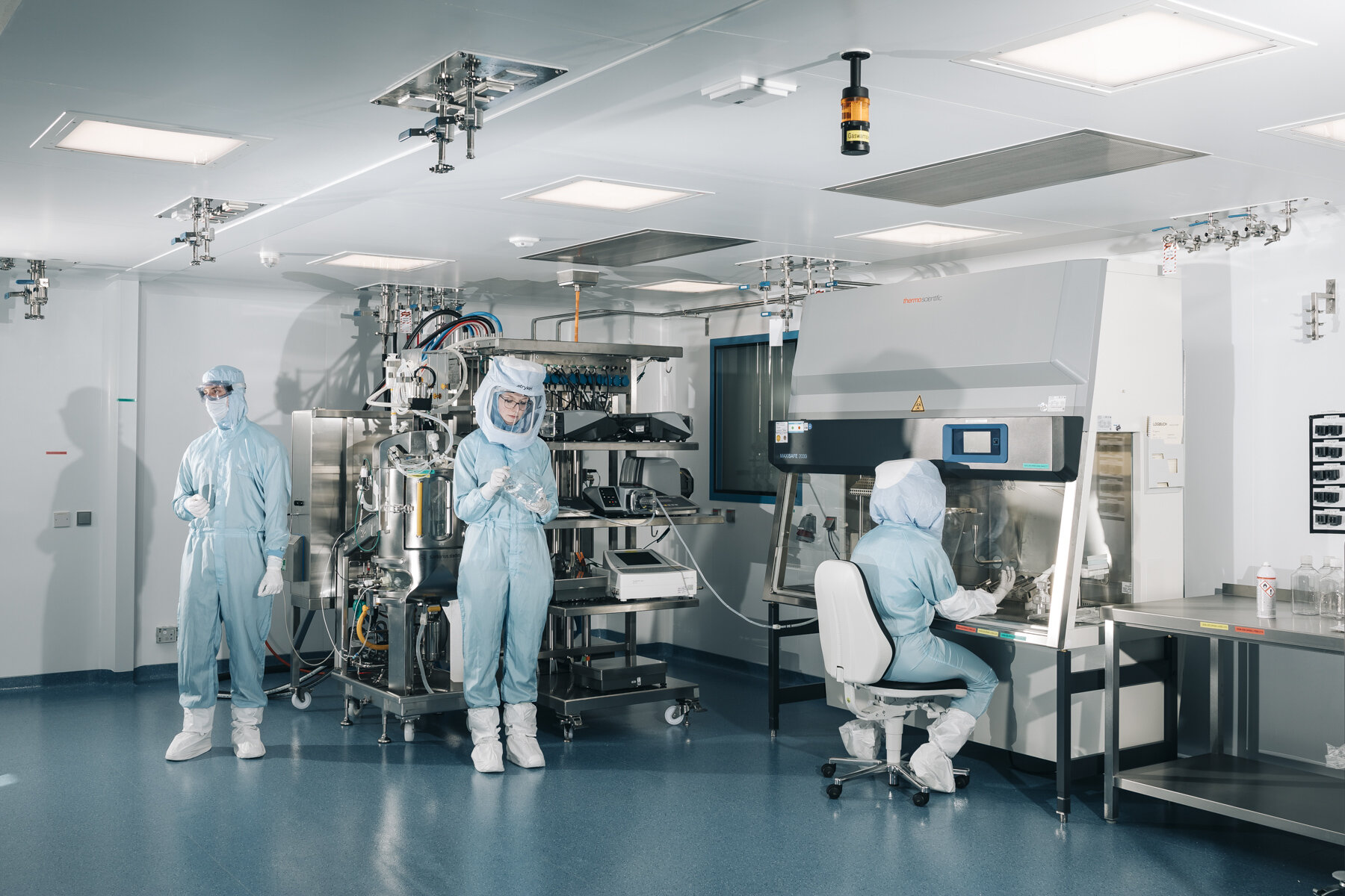  Biontech employees at the Biontech plant in Marburg  show how they work on the bioreactor in cleanroom suits. From April 2021 more than one billion doses of Vaccine can be produced here annually.  