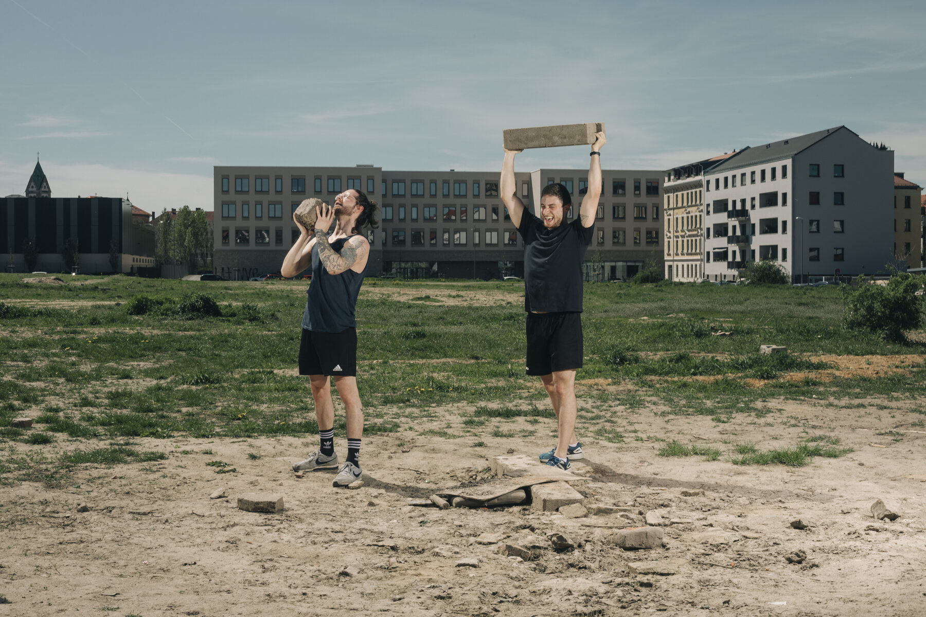  While fitness studios are closed, Max and his friend do their workout in the open air on a fallow land in Leipzig. 