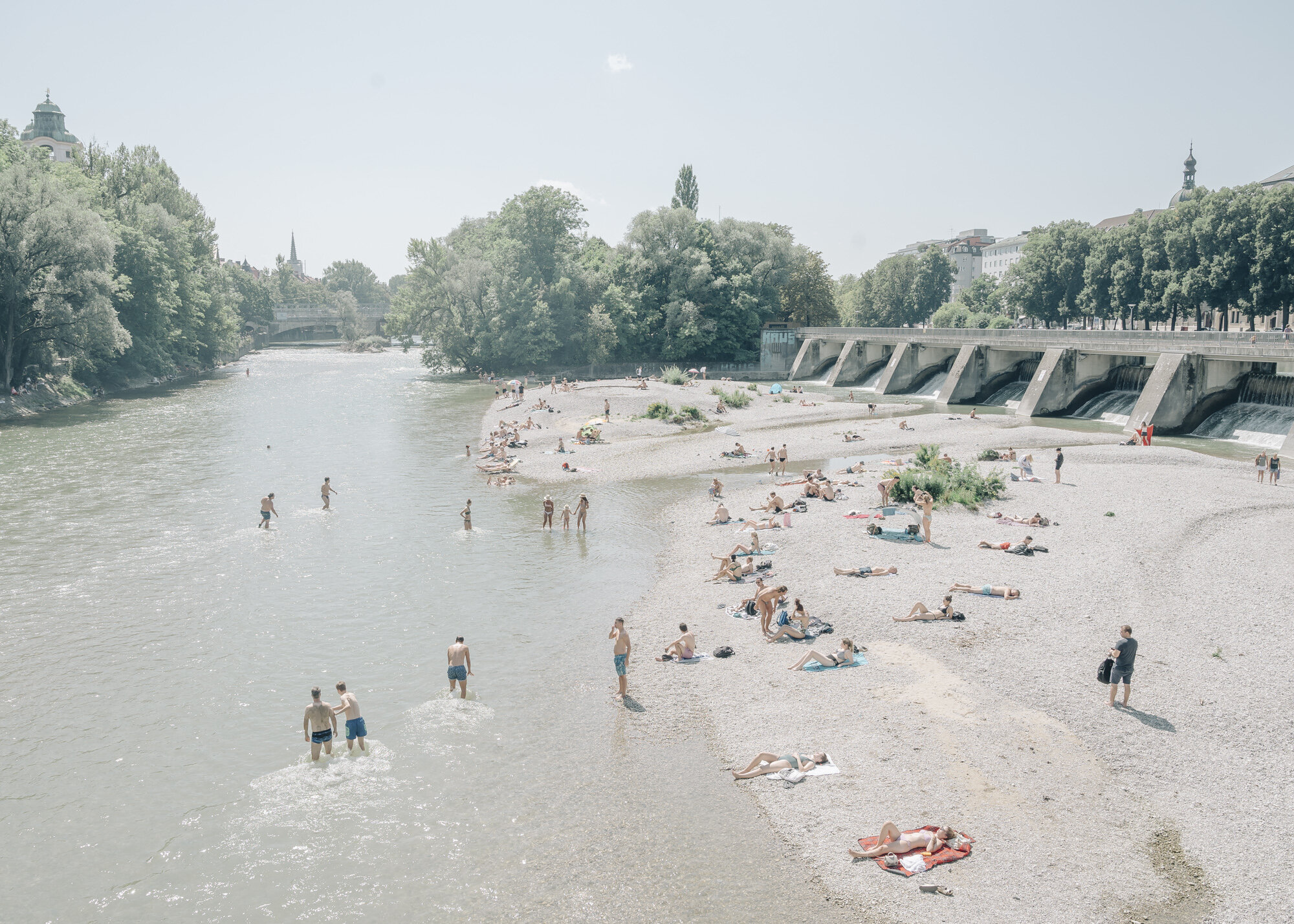 Bathers enjoy the summer on the Gries on the Prater Island of the Isar in Munich's city centre. 