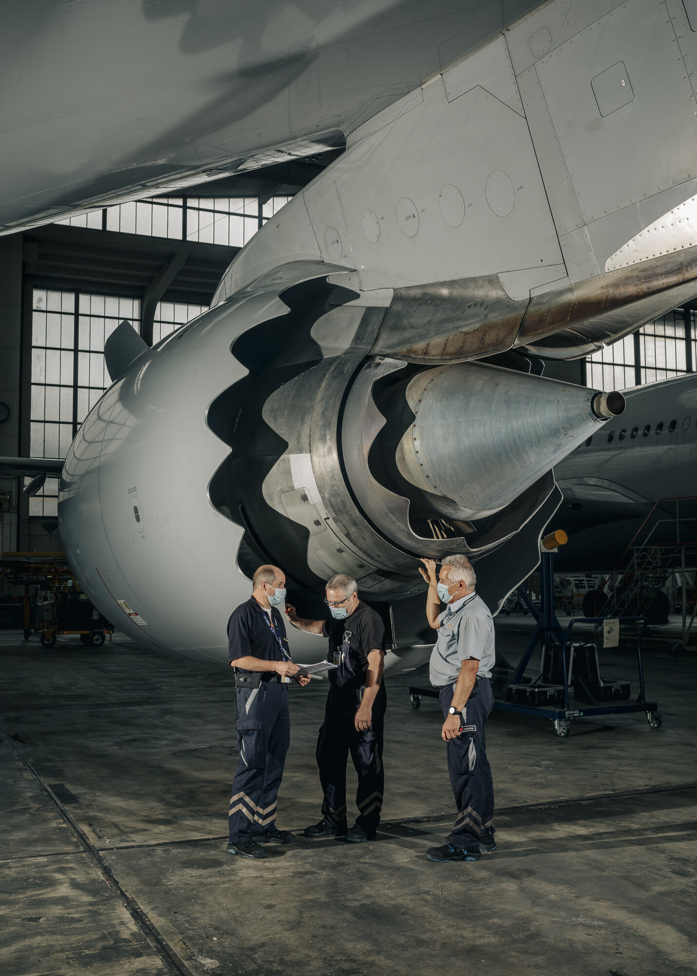  Aircraft mechanics Klaus Kolling, Josef Stapp, Bernd Hötschl check the engine of a Boeing 747-8 that was parked during lockdowns and the reduced air traffic. 